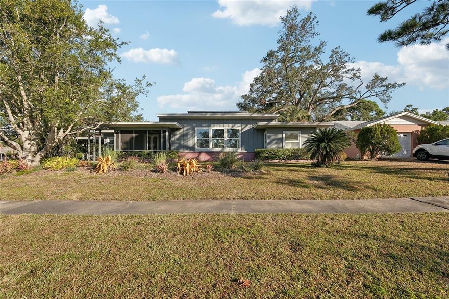 Built in 1950, 349 Scott Avenue is a rare find — a property where original character hasn’t been replaced, but respected. Thoughtful remodels over the years have preserved the timeless feel of this classic Sarasota bungalow, allowing its architectural integrity and warmth to remain intact. Inside, original oak flooring, high ceilings, and oversized hurricane-resistant windows reflect a time when homes were built to breathe, endure, and connect naturally to their surroundings. Sunlight moves easily through the living spaces, highlighting craftsmanship that feels authentic rather than manufactured.  Set on an exceptional .52-acre parcel, the grounds are nothing short of special. At the heart of the landscape stands a majestic oak tree estimated to be over 100 years old — a living landmark that anchors the property both visually and historically. Around it, lush, Florida-friendly plantings have been carefully curated by long-time owners who understood that true beauty matures over time. This is a setting designed for shade, serenity, and a deep sense of place. A new roof (2025) adds modern reassurance, seamlessly complementing a home that balances preservation with practicality. This home values heritage over trends, land over lot lines, and character over convenience alone, this is a meaningful opportunity to become the next steward of a truly special Sarasota home.  Homes with this level of history, land, and authenticity are increasingly rare — schedule your private showing to experience it in person.