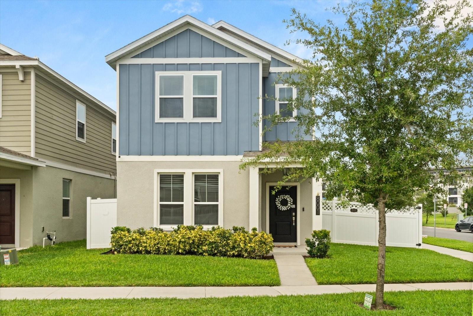 Nestled on a spacious corner lot in the highly desirable community of Storey Grove, this stunning 4 bedroom, 3.5 bathroom home is move-in ready and packed with charm, functionality, and modern finishes throughout. From the moment you arrive, you'll be drawn in by the lush landscaping and the convenience of a rear detached 2-car garage offering plenty of storage. Step inside to discover pristine tile flooring, soaring high ceilings, and an open-concept layout bathed in natural light from oversized windows. The cozy living room features a charming brick fireplace, creating the ideal ambiance for gatherings with loved ones—especially during the holidays. The heart of the home is the gourmet kitchen, sure to impress with shaker-style cabinetry, a subway tile backsplash, stainless steel appliances, and elegant quartz countertops that extend over a large center island—perfect for morning coffee chats or casual dining. The kitchen seamlessly opens to the dining and living areas, making entertaining effortless. On the main floor, you'll find a spacious guest suite with a walk-in closet and a luxurious en-suite bathroom featuring double vanities and a massive walk-in shower. Ideal for visiting guests or as a second primary suite for multigenerational living. Upstairs, a large loft/flex space offers the versatility to create a game room, second living area, or playroom. The primary suite is a true retreat, highlighted by unique rattan light fixtures, a generous walk-in closet, and a spa-like en-suite bathroom with dual sinks and an oversized walk-in shower. Two additional upstairs bedrooms provide flexible space for a home office, guest rooms, or hobby spaces, each filled with natural light and charm. Out back, the fully fenced-in backyard is an outdoor haven for pets to roam freely, hosting summer barbecues or simply relaxing in a hammock under the shade. With easy access to your rear-entry garage, the layout is as functional as it is beautiful. Residents of Storey Grove enjoy resort-style amenities, including a sparkling community pool, playgrounds, walking trails, a fitness center, clubhouse, and more. Centrally located near top-rated schools, shopping, dining, and commuter routes, this is a rare opportunity you won’t want to miss. Schedule your private tour today—this incredible home won’t last long!