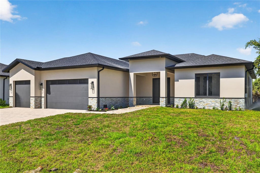 Photo of 9668 President Circle, Port Charlotte, FL 33981 (MLS # O6431444)