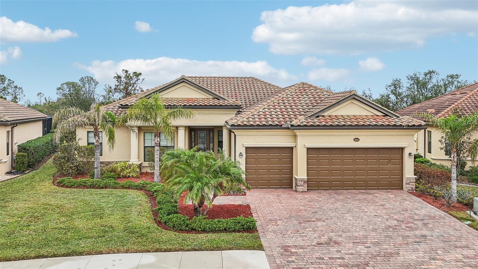 Best value for an Oakmont home in Gran Paradiso! This 4 BR, 2.5 BA, 3-car garage Estate-series Oakmont pool/spa home in the gated resort-style community of Gran Paradiso at Wellen Park is located on a private preserve homesite and is ready for move-in! As you step into this beautiful home, you will love the open floor plan, abundance of natural light, soothing neutral color palette, decorative crown molding, tray ceilings, and sparkling pool & spa. The home features 10' ceilings and 8' doorways and a split layout that allows for privacy when family & friends come to visit. The flooring in your entry, living and dining areas, kitchen, baths and hallways is 20" porcelain tile on the diagonal, while the bedrooms feature carpeting. The Chef's kitchen offers granite countertops, stainless-steel appliances, built-in double ovens, pantry and a breakfast area with a view. Enjoy your morning coffee at the breakfast bar, overlooking your spacious lanai and pool/spa, enjoying the unrivaled privacy of a preserve view. Your Primary Bedroom Suite has a sitting area, access to the lanai & pool/spa, a large walk-in closet and the En-Suite Primary Bath offers dual vanities, a convenient walk-in shower and corner garden tub for relaxing baths. The adjacent wing of the home features 2 guest bedrooms that share a guest bath with shower over tub and a glass shower enclosure. There is another half-bath in Guest Room 3 with outdoor access. The 4th Bedroom is ideal for a home office or den. From your Great Room, step onto your lanai through the large sliding glass doors and enjoy Florida living with gentle breezes and chirping birds. Gather with family or friends on the covered sitting area on your lanai or enjoy a refreshing dip in your pool. Completing this home is a spacious laundry room with utility sink and a 3-car garage that provides ample storage space. Brand-new garbage disposal (2025). Gran Paradiso is an amenities-rich, maintenance-free community, situated in the master-planned Wellen Park area with restaurants, shopping, the Atlanta Braves Spring Training stadium & more! Your new home is only 10 min away from the amazing beaches of the Gulf of Mexico! Gran Paradiso residents enjoy a magnificent community pool, Tuscan-inspired Clubhouse, tennis, pickle ball, fitness center, sauna/steam rooms, massage room & a myriad of activities, organized by a full-time Lifestyle Director. Leave the cold Northern winters behind and enjoy life in paradise!