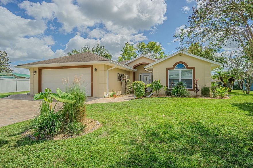 PICTURE PERFECT and perched on a large, serene POND, this charming home in Tampa Bay Golf & Country Club is waiting for you!  Located on an OVERSIZED lot in one of Tampa Bay’s active, 55+ man guard GATED communities, this beautifully maintained residence offers the ideal Florida lifestyle.  A newly painted exterior, 2021 AC, 2018 Roof, and STUNNING paver driveway and walkways set the tone as you arrive. Glass storm door welcomes you into a light-filled great room featuring Cathedral ceilings, Crown molding, Luxury Vinyl Plank floors, neutral paint and an Entertainment niche for TV.  Triple pocketing sliding glass doors open seamlessly to a 256-square-foot, fully enclosed and tiled Florida room that spans the length of the home... perfect for entertaining or simply relaxing while enjoying panoramic pond and park-like backyard views!  The Light, Bright, SPACIOUS kitchen will impress with its abundance of cabinets and GLEAMING GRANITE counter space, Gray subway Tile backsplash with accent backdrop, Stainless steel Whirlpool & Bosch appliances, breakfast bar, closet pantry, and a slider window above the sink that frames the water view. The open-concept dining area sits adjacent to the kitchen and is bathed in natural light from double windows, allowing for casual or formal meals. The owner's suite is tucked privately at the rear of the home and offers tranquil pond views through sliding doors (with honeycomb shade for privacy) to the lanai. It features a tray ceiling, walk-in closet, STUNNING floors, and an ensuite bath with dual square undermount sinks in Granite counters and a walk-in shower. The split floor plan provides a light, bright guest bedroom and full bath with Granite counters, at the front of the home, offering comfort and privacy for visitors.  Additional highlights include an interior laundry room with high-efficiency washer and dryer, stunning tile floor, storage above and is just off the screened two-car garage with new Genie opener, new springs, sensors & motherboard. Paver walkway around side entrance with privacy fenced sideyard. This home is located in the village with the lowest HOA fees, which include high-speed internet and basic cable, with optional yard maintenance available. Quick closing is possible, with Golf Cart, furniture and artwork Negotiable. LIVE the RESORT Lifestyle in Tampa Bay Golf & Country Club where Residents enjoy access to two pristine golf courses (championship 18-hole and executive 9-hole), tennis and pickleball courts, two resort-style pools, hot tub, shuffleboard, bocce, cornhole, a state-of-the-art fitness center, library, card rooms, billiards, and a full-service restaurant, pub/grille, pro shop, and newly remodeled clubhouse with banquet facilities, dance floor, and live entertainment. Golf carts are welcome, with private streets and frequent community activities and travel excursions, there ALWAYS something to do in this vibrant social community... OR just Rest Easy and enjoy the SPECTACULAR water views from your enclosed Sunroom!  CALL TODAY...to see why this truly IS the PLACE to BE!