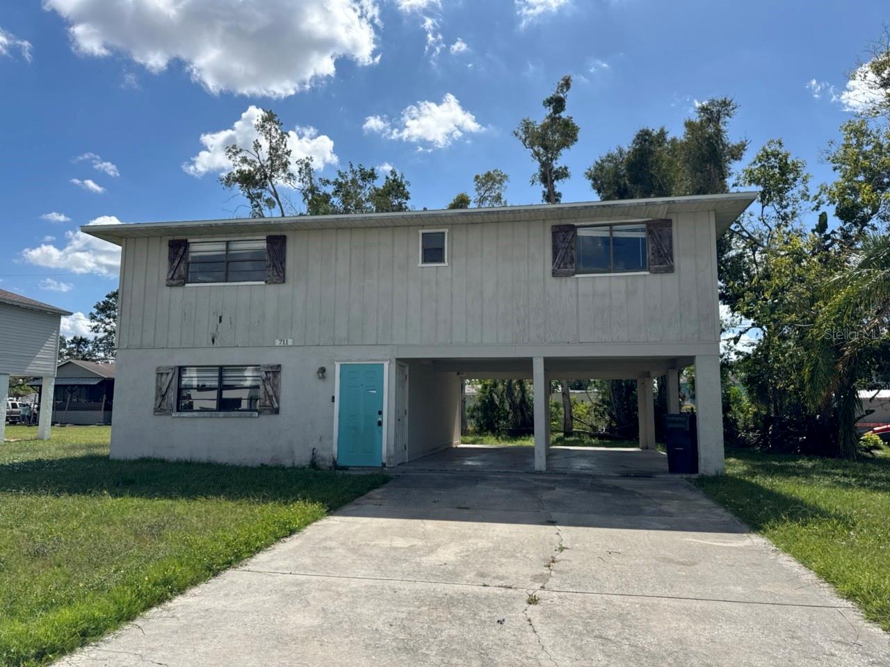 Two story-built home in Palmetto Point neighborhood, living area above flood plain. Great home for investor or ready for a new homeowner to remodel to their liking! Open floor plan with lower area storage. covered parking. Large second floor deck area. Room for a pool. Community boat ramp for easy waterfront access to beautiful beaches.