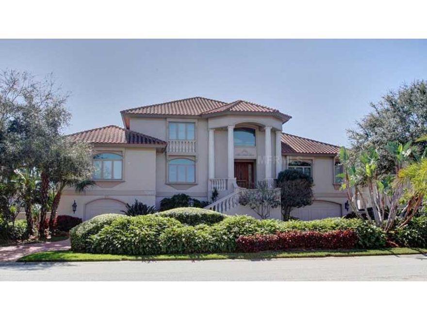 Beautiful contemporary residence located in the desirable guard gated waterfront community, Bayway Isles. This home is sited on an oversized 100x135 (1/3 +/- acre) lot with sweeping views of the open waters of Tampa Bay and the Skyway Bridge. Designed and built in 1995 by the current owners this home offers 5,265SF of interior air conditioned living space, 4-bedrooms, 4-full baths, 1-half bath, 1-pool bath and a 3 plus car garage with 3900+SF. Beautifully detailed, this luxurious retreat features 10' ceilings throughout, 23' ceilings in the living room & foyer, custom 6" & 12" crown moldings, 8" baseboards, exquisite millwork, oak hardwood, tile & carpet flooring, solid wood doors, 3-stop elevator, central vacuum, and plenty of storage space. The bright and airy floor plan was thoughtfully designed with formal living & dining, a superb gourmet kitchen, spacious family room, executive office, guest suite and opulent master suite. The chef inspired kitchen boasts maple cabinetry, 1 ½" granite counters, center island with cooktop, high end appliances, breakfast bar and casual dining area all with great water views. The outdoor enthusiast will be delighted with the pebble tech finished self-cleaning pool, boat dock with water, electric & fish cleaning table, a 16K lb. boat lift, pole tiles for up to a 65' vessel, seawall davits (to put your toys in the water) and dock seating to watch the sunsets.