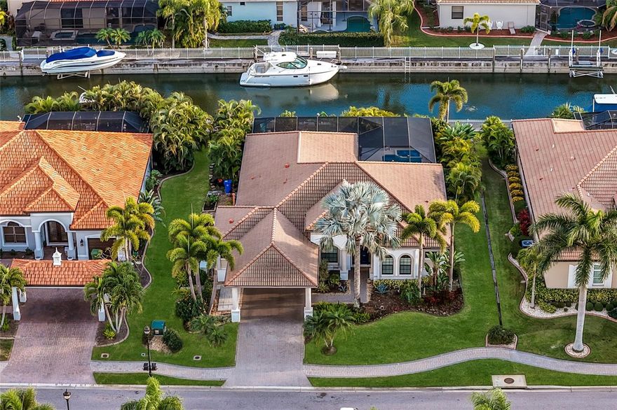 Welcome to your boater’s paradise in Harbour Walk at the Inlets, a prestigious gated boating community. This bright and airy open-concept floorplan, all on one level with soaring ceilings and sliding glass doors that blend indoor and outdoor living, features four bedrooms, a den/office, and a two and half car garage . Surrounded by lush greenery to ensure maximum privacy, this rare oasis has an expansive screened lanai with extra covered space, a full outdoor kitchen, pool, and spa with southern exposure to fully enjoy the Florida sunshine and lifestyle. Host unforgettable gatherings or simply unwind by your private pool and spa after a day on the water. Dock your boat in your own backyard, on a peaceful canal with direct access to the Gulf for endless boating adventures to the Tampa Bay and the Keys. Enjoy the convenience of docking at nearby restaurants and fueling stops along the Manatee River. This home sits on a freshwater canal that is completely operable and safe from any storm surges. Fully equipped with a whole house generator, hurricane shutter protection on all windows and doors that are very easy to use so you can serenely lock your home and travel the world. Conveniently located, with plethora of shopping, dining, and entertainment nearby, this exceptional property provides easy access to the keys (Anna Maria, Longboat Key and Siesta Key) and to all infrastructures (2 miles away from i75, 12 miles from SRQ – Sarasota Bradenton International Airport, 43 miles from PIE - St Pete - Clearwater International Airport and 50 miles away from TPA - Tampa International Airport). Based in Bradenton, famously renowned worldwide for its IMG Academy, Harbour Walk offers a wide range of amenities including a kayak launch, fishing dock, playground, tennis courts, and walking trails, all within a private, gated community. Plus, with no CDD fees & cable/internet included, you're enjoying all the perks without the extra cost. Whether you seek relaxation or an active lifestyle, Harbour Walk at the Inlets offers a unique waterfront experience. Don’t miss your chance to call this coastal gem home!