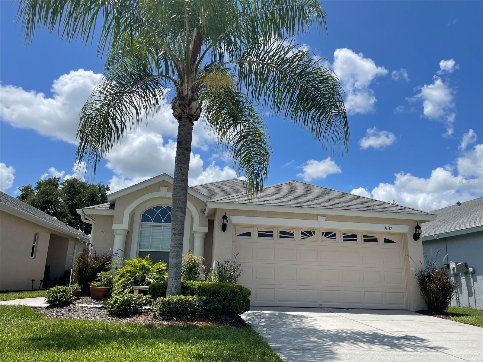 This ready for you single family home in the heart of Wesley Chapel on the outskirts of The Grove is where it is happening. This 2 bedroom plus den, 2 bathroom and 2 car garage pool home also includes lawn and pool maintenance. The outside screened area with lovely landscaping has a small wading pool just perfect for cooling off and lounging around. The split plan allows for privacy and has a large great room area in the middle with a den/office off to the side that could also be used for a small formal living space. The dining area is just outside the upgraded kitchen with stainless steel appliances and granite countertops. The gas stove already has propane hooked up! The master has plenty of space for a king bedroom suite and the master bath has separate vanities on each side of the oversized shower. You can walk to The Grove and enjoy the restaurants, shopping, entertainment and the new Kratez.