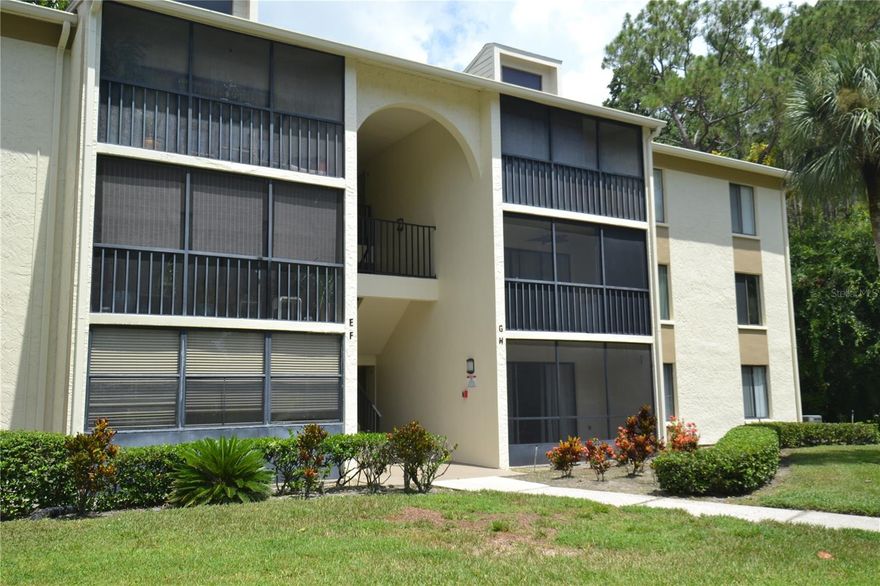 Call  to see this exceptional UNFURNISHED 2nd story end-unit condo in the highly sought-after Pine Ridge at Lake Tarpon. Location, Location, Location! This beautifully updated 2-bedroom, 2-bathroom condo offers peaceful views from your private screened patio ideal for morning coffee or evening relaxation. The desirable split-bedroom floor plan ensures added privacy, and your reserved parking space is just steps from your front door.  Enjoy the convenience of a full-size washer and dryer in the unit, and water and trash are included, making this home both comfortable and hassle-free.  The Pine Ridge community features a large crystal-clear pool, relaxing spa, and tennis courts at the clubhouse, offering excellent recreational options right at your doorstep. Located just minutes from shopping, dining, and entertainment along Tampa Road and East Lake, with easy access to the airport and the world-famous Gulf beaches.  Don't miss the opportunity to live in one of the areas most desirable communities.