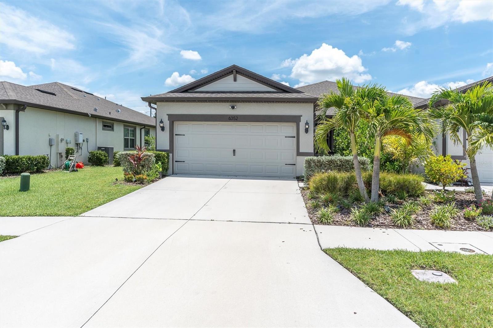 2021 VILLA in GATED highly desired WATERSET. Spacious OPEN FLOORPLAN, 1,584 sq.ft. SPLIT-STYLE with Primary Bedroom (15’4” x 12’3”) with an EN-SUITE BATHROOM in the back of the Villa and a Second Bedroom (13’8” x 10’9”) in the front of the Villa with an adjacent Bathroom. A FLEX-SPACE with French Doors, a LAUNDRY ROOM, and a 2-Car garage. The 9' CEILINGS with dual-pane windows add natural light throughout. KITCHEN includes 42"upper cabinets, a spacious island, quartz countertops, tiled backsplash, stainless steel appliances including a GAS range, a deep under-mount stainless-steel sink, and a spacious CLOSET PANTRY. THREE-STACKING sliding glass doors open to the covered PATIO with room for you to expand with your imagination. The Villa includes a Sentricon TERMITE PREVENTION System, a Built-In PEST CONTROL system, a tankless water heater, and includes Hurricane Shutters. NOT IN A FLOOD ZONE. The villa is constructed with CONCRETE BLOCKS and features decorative architectural elements – It’s solid! The PRIMARY BATHROOM features a spacious walk-in tiled shower, dual sinks with quartz countertops, a huge walk-in closet, a toilet room, and a linen closet. The LAUNDRY ROOM is the location of the 30” ENCLOSED PANEL for the SMART HOME. WATERSET has planned community centers throughout that feature FITNESS GYMS, three (4th in progress) POOLS, a separate pool with WATER SLIDE/SPLASH PAD, clubhouses with meeting rooms, dog parks, and approximately 12 MILES OF TRAILS. Drive a golf cart on the roads! Walk to local restaurants and retail businesses. Get your game on at the basketball, pickleball, tennis, sand volleyball courts, and multiple parks throughout the community. Close to rivers, marinas, restaurants, parks, and South County beaches. Proximity to I-75 or US 41.