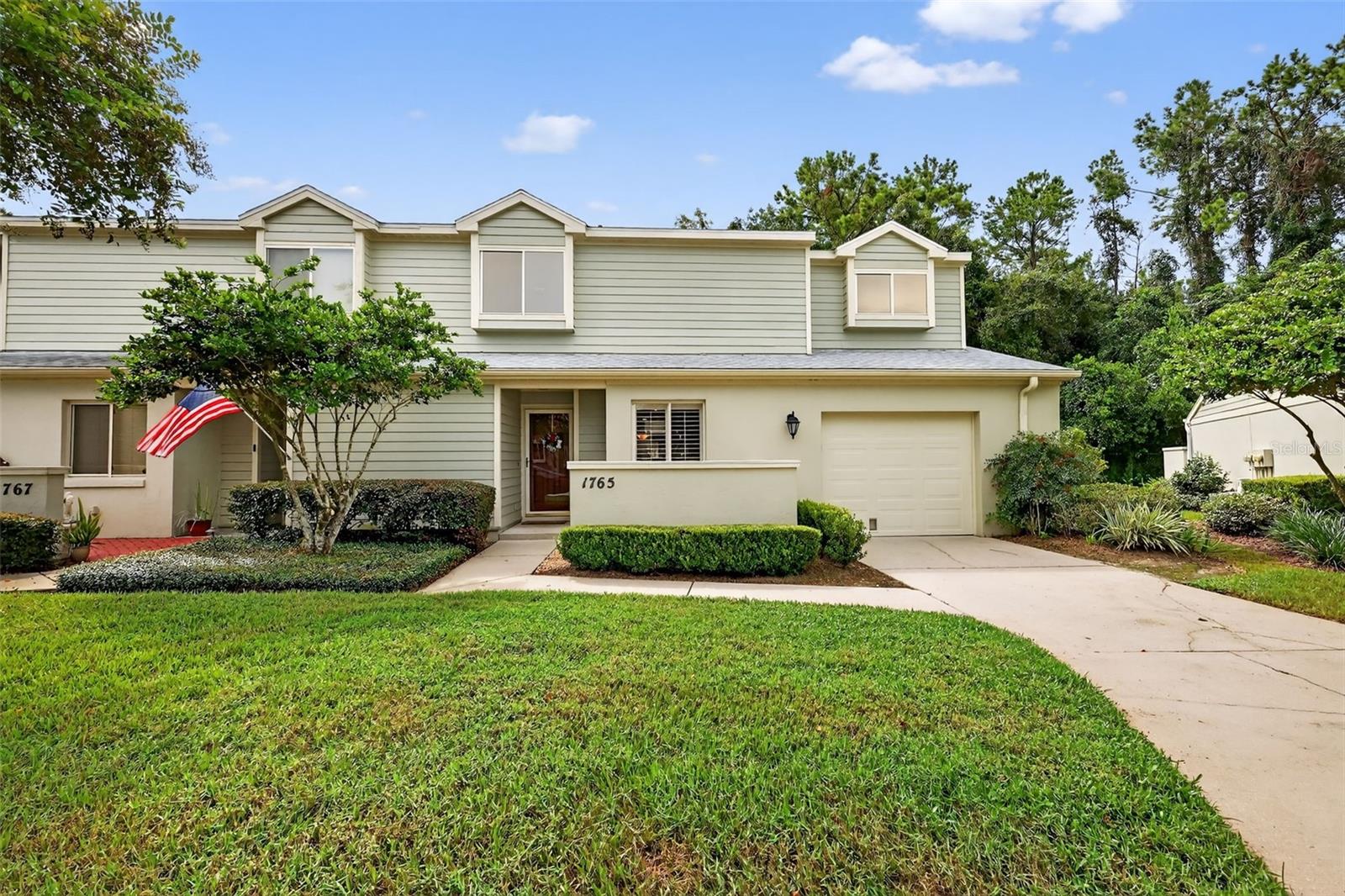 Welcome to this 3 bedroom 2.5 bath beautiful home nestled in a quiet, low-maintenance community in the heart of SE Ocala. Designed for easy living, this light and bright residence features a spacious open floor plan with neutral tile flooring in the main living areas, soaring cathedral ceilings, large windows, and a cozy wood-burning fireplace. The kitchen is both functional and stylish with rich cabinetry, granite countertops, and a seamless flow into the dining area and expansive great room—perfect for entertaining. The main-level master suite is a true retreat, offering a huge bedroom, a walk-in closet with built-ins, and an en-suite bath with marble counters and a step-in shower. Upstairs, you’ll find a versatile loft living area, ideal for a home office or den, along with two generously sized guest bedrooms. Each bedroom features its own walk-in closet and shares a convenient Jack-and-Jill bathroom. Step outside to your private screened patio, complete with a privacy wall—ideal for year-round relaxation or entertaining friends. Additional highlights include storage space throughout and access to the community’s sparkling pool and clubhouse—all without the hassle of exterior maintenance. Don’t miss this opportunity to enjoy carefree living in one of Ocala’s most sought-after areas!