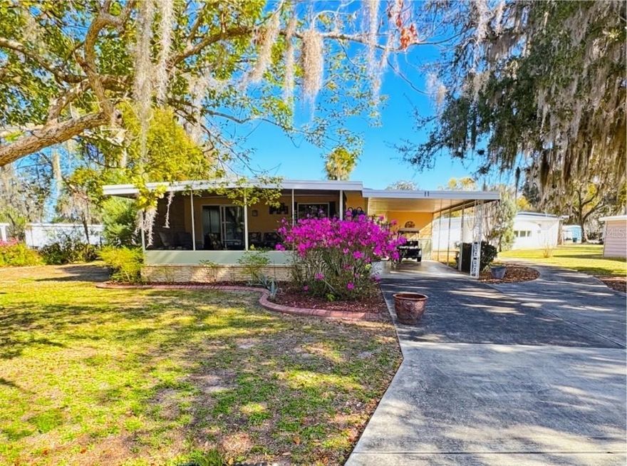 Welcome to this beautifully updated home offering comfortable living space and thoughtful upgrades throughout!. The home features 2 bedrooms both generously sized with plenty of room for full bedroom sets and additional seating or workspace. Both bathrooms are well-appointed and designed for comfort and convenience.
Gorgeous renovated kitchen (10’ x 20’) – absolutely stunning with modern finishes, ample counter space, and room to entertain or add a breakfast nook. This kitchen is truly the heart of the home!
 The large screened front porch is the perfect place to relax and enjoy beautiful views while staying comfortable year-round.
 Beautiful engineered hardwood flooring throughout the entire home – durable, stylish, and easy to maintain.
Large carport with plenty of covered parking.
Outdoor utility room – ideal for extra storage, tools, or hobbies. 
This home combines comfort, style, and functionality, making it perfect for full-time living or a peaceful retreat. With its stunning kitchen, spacious layout, and inviting outdoor space, this property is move-in ready and waiting for you!  The community is absolutely gorgeous with countless amenities, which include: large swimming pool with hot tub, 18 hole championship golf course, driving range and putting greens, shuffleboard, tennis, pickle ball, fitness center, iibrary, billiards room, softball field, and a 5 star restaurant and lounge. What more can you ask for? This is a beautiful home in a beautiful community. You won't be disappointed!!!!