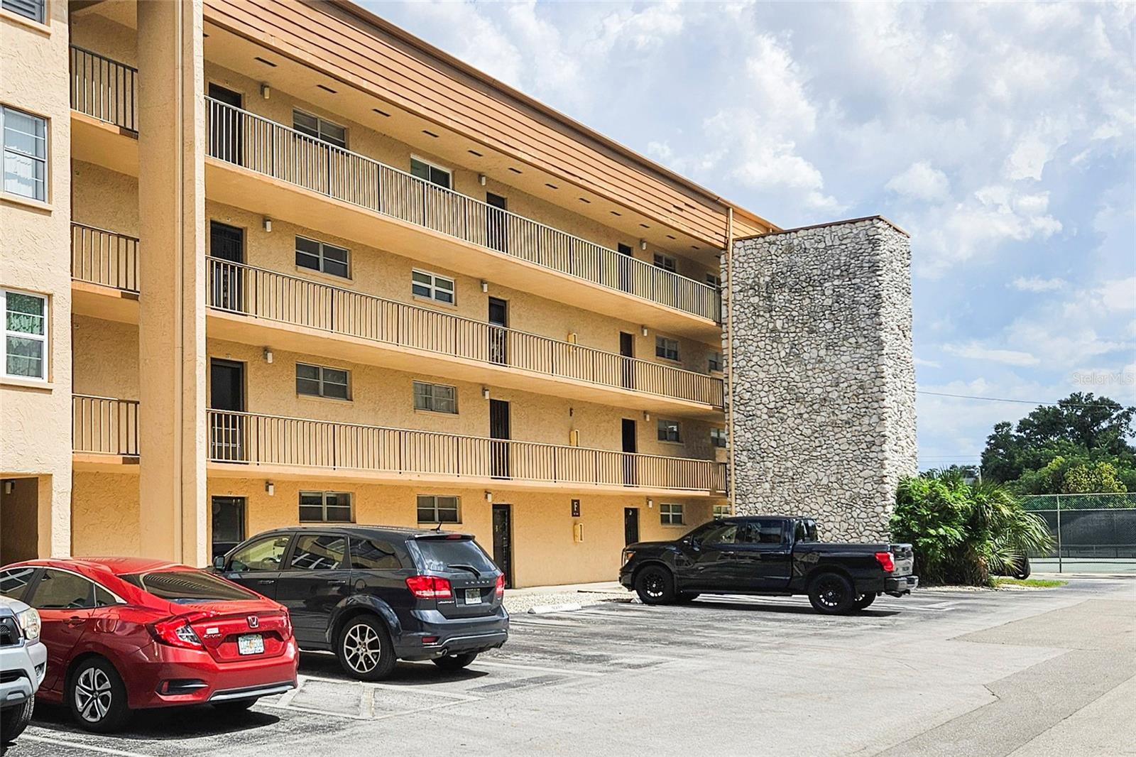 One or more photo(s) has been virtually staged. Welcome to Easy Living in the Heart of North Tampa!
This delightful 2-bedroom, 1-bath condo is nestled on the top floor of the gated Tampa Racquet Club community, offering peace, privacy, and no upstairs neighbors! Enjoy the convenience of an elevator and the comfort of LPV flooring throughout, including in both spacious bedrooms with mirrored closets and easy access to the full bathroom.
The bathroom features a tile shower/tub combo and a stylish decorative sink with extended counter space—both functional and attractive. Step into the warm and welcoming kitchen, which opens beautifully to the dining and living room combo—perfect for entertaining or relaxing at home.
The generously sized living room leads to sliding glass doors and a private balcony—an ideal spot to sip a cool drink and soak in the Florida breeze.
Tampa Racquet Club offers resort-style amenities, including a sparkling pool with outdoor grilling area, tennis, racquetball, and basketball courts, a clubhouse with bar lounge, fitness center, library, and more!
Centrally located near everything Tampa has to experience—Raymond James Stadium, International Plaza, top dining and shopping, Tampa International Airport, and Downtown Tampa are all just minutes away.
Don’t miss your chance to own this perfectly located, move-in-ready condo—schedule your tour today!
