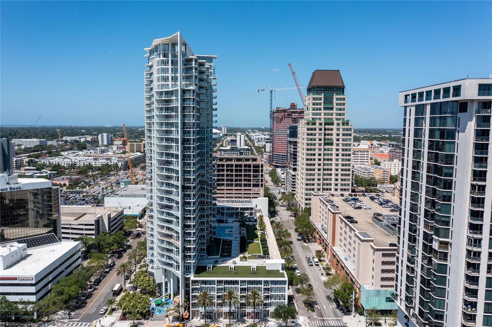 Welcome to Signature Place, where contemporary elegance and urban convenience come together in the heart of downtown St. Petersburg. This stunning, updated condo offers breathtaking view of Tampa Bay, St. Pete Pier and the marina from the comfort of your living room! It boasts two generously sized bedrooms with ample closet space, two full bathrooms, and a bright, airy living area that flows seamlessly onto a private outdoor deck-perfect for soaking panoramic views of the downtown skyline, waterfront, and Rowdies stadium. The modern kitchen was updated in 2023 with high-end appliances and abundant storage. Signature Place offers an unparalleled lifestyle with resort-style amenities, including a rooftop pool and sundeck, a cutting edge fitness center, and a stylish resident lounge. With 24 hour concierge service, residents enjoy both security and convenience. Step outside and immerse yourself in the vibrant energy of downtown, where top-rated restaurants, chic boutiques, cultural attractions, and live entertainment are just moments away. This unit also includes two secured, covered parking spaces on the same floor for easy access, plus a dedicated storage locker just steps from your door. For those seeking a luxurious and sophisticated living experience in an unbeatable downtown location, this exceptional condo is the perfect place to call home!