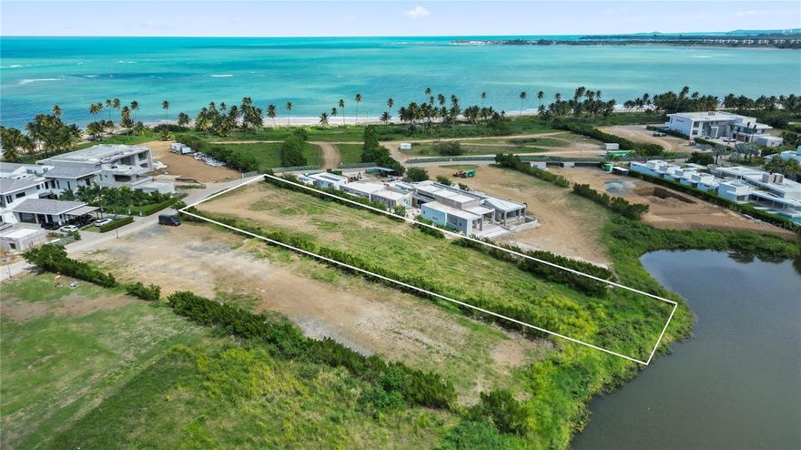 Atlantic Drive Homesite | Four Seasons Residences at Bahía Beach | Río Grande, Puerto Rico

A singular opportunity has emerged within one of the Caribbean's most coveted private communities — and it will not come again.

This 1.15-acre lakefront homesite on Atlantic Drive represents one of the last remaining opportunities to build a custom residence within the Four Seasons Residences at Bahía Beach Resort & Golf Club. With the developer having permanently closed custom home sales, no new lots will ever be offered. For the discerning buyer, this is a final chapter — and a defining one.

Set behind the private gates of Bahía Beach in Río Grande, this exceptional parcel is among the rare few commanding both direct lake views and lake access — a feature that elevates it above virtually every other homesite in the community. Lush tropical surroundings, mature landscaping, and the quiet elegance of neighboring estate homes create an atmosphere of absolute privacy and refinement.

The generous proportions of the lot invite a grand architectural vision: expansive outdoor terraces, an infinity pool overlooking the water, lush gardens, and seamless indoor-outdoor living — all on your own terms, designed from the ground up.

As a resident of Atlantic Drive, you become part of the Four Seasons branded residential enclave, with access to the full spectrum of resort amenities: the acclaimed Robert Trent Jones Jr.–designed championship golf course, miles of private nature trails, pristine beachfront, and the incomparable service culture of the Five-Star Four Seasons Resort — fine dining, world-class spa, and hotel privileges just steps from home.

Beyond the gates, the location is equally compelling. San Juan's international airport, dining, and culture are within easy reach, while the ancient rainforest of El Yunque frames the horizon.

This is not simply a lot. It is the last canvas of its kind — where lakefront serenity, Four Seasons luxury, and permanent exclusivity converge into something truly irreplaceable.