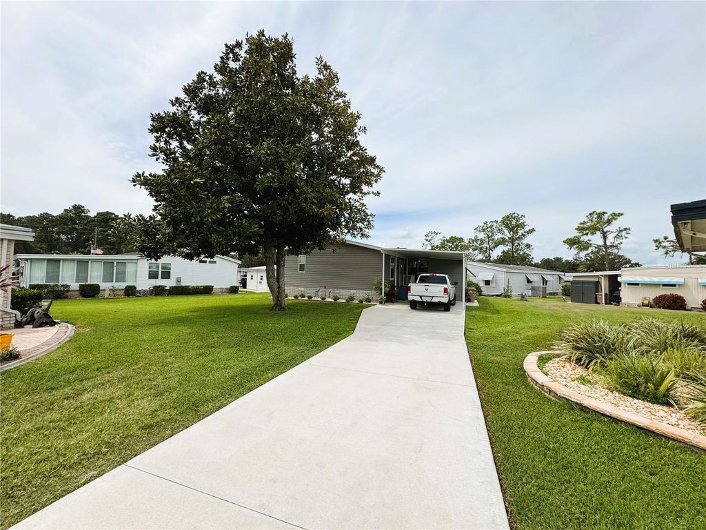 Photo of 102 Dogwood Trail, Leesburg, FL 34748 (MLS # R4909942)