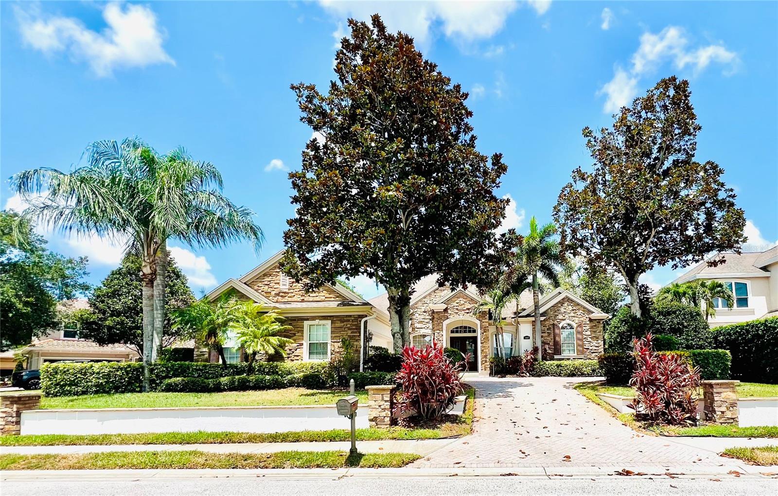 Almost 4,000 square feet for UNDER $1 MILLION in CHAMPIONS CLUB! NEW EXTERIOR PAINT + NEW WINDOWS (16 panels) + NEW POOL MOTOR! BREATHTAKING SUNSETS over the GOLF COURSE from this EXCEPTIONAL home, on 1/3 ACRE, nestled in the highly DESIRABLE LUXURY neighborhood of Champions Club. IMPECCABLE 4 Bedroom + OFFICE + Upstairs BONUS ROOM (Could be HUGE 5th Bedroom or In-Law Suite - has EXTRA LARGE closet + EN-SUITE BATHROOM)/4.5 Bathroom (Including POOL BATH + one full bathroom upstairs)/Oversized 3-Car Garage POOL Home. FANTASTIC OUTDOOR living space! GREAT for ENTERTAINING! Splash into the AMAZING SALT POOL with WATERFALL SPA decorated with STUNNING TRAVERTINE! Immediately notice the BEAUTIFUL curb appeal + EXTRA LONG PAVER DRIVEWAY provides PLENTY OF PARKING. Upon entering this IMMACULATE home through the DOUBLE DOORS, be overwhelmed with the OPEN FLOOR PLAN + CROWN MOLDING + tons of NATURAL LIGHT + PLANTATION SHUTTERS throughout. DESIRABLE floorpan with 4 bedrooms (FIRST FLOOR PRIMARY SUITE includes TWO CUSTOM walk-in closets, sliders to the lanai, SPA-LIKE primary bathroom with DUAL SINKS, GARDEN TUB, and LARGE SHOWER) + 4 FULL BATHROOMS + 1 HALF/POOL BATHROOM + Upstairs BONUS ROOM with its own FULL BATHROOM! GENEROUS COMPLETELY UPDATED GOURMET eat-in kitchen has GRANITE countertops, HUGE ISLAND, BREAKFAST BAR, and STAINLESS STEEL appliances (including a GAS STOVE). Separate Dining room + Family room with SLIDERS out to the lanai! INSIDE LAUNDRY ROOM! Come enjoy the COUNTRY CLUB lifestyle...EXCLUSIVE Champions Club Community offers POOL + TENNIS COURTS + FITNESS CENTER + CLUBHOUSE + PRIVATE RESIDENT ONLY EVENTS. Sought after TRINITY schools! Conveniently located near restaurants, shopping, and the Veterans. Schedule your private showing today!