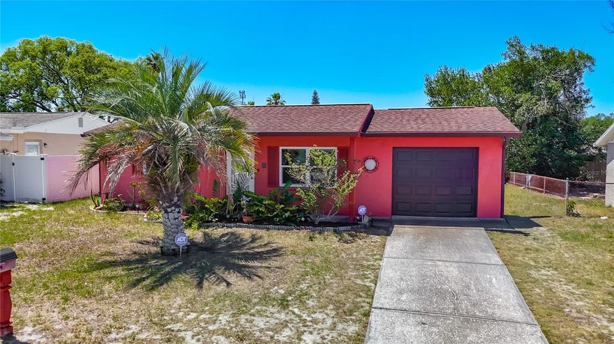 This charming 2-bedroom, 1-bathroom home is situated in a well-established neighborhood, offering both comfort and convenience close to shopping, dining, and schools. Step inside, the open floor plan features a spacious living room and dining room combo, seamlessly connecting to the kitchen. The kitchen boasts ample cabinets and generous counter space, ideal for meal preparation and entertaining guests. Both bedrooms are spacious.  The main bathroom has been nicely updated with a tile shower and a new vanity. Recent updates include a roof replacement in 2013, AC 2018, water heater 2020, hurricane windows 2024 and hurricane door in 2024. Oversized garage includes the washer & dryer. This home has been well maintained and move-in ready. Minutes from US 19 and Close to the Suncoast parkway for quick access to the airport, Tampa, Clearwater and St. Pete Beaches (Ranked in the top 5 Beaches in the US), also close to SunWest Park…an outdoor recreation water park, beach, swimming and gorgeous sunsets, Homosassa Springs, the famous Weeki Wachee live mermaids and Tarpon Springs Sponge Docks. Short drive to beautiful downtown New Port Richey…a historic Rivertown community in north Tampa Bay with award-winning restaurants, shops, bars, and breweries. Its rich history is preserved by the Hacienda Hotel, Richey Suncoast Theatre, and the New Port Richey Museum. Natural amenities like Sims Park, the Cotee River, and James E. Grey Preserve are waiting to be explored. NO CDD, NO HOA FEES, NO FLOOD INSURANCE.