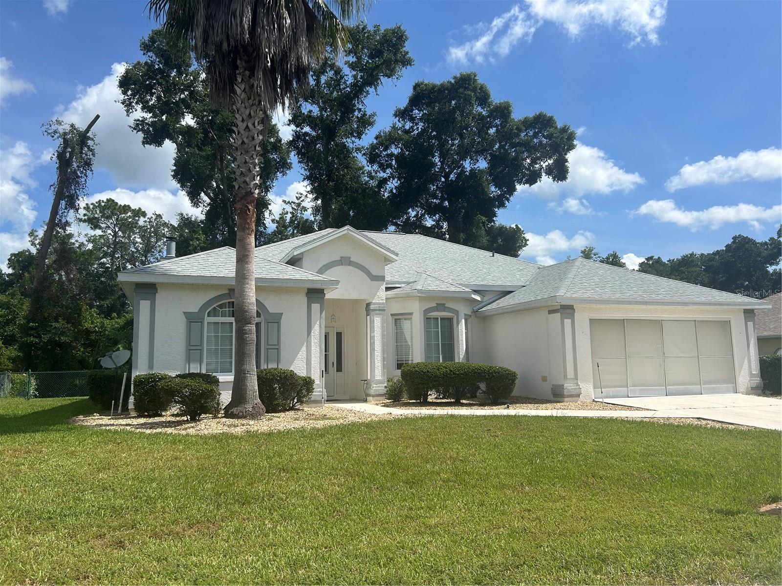 Rare Fiji Model in Ocala Palms! Move-in ready 2/2 and large office. NEW ROOF (2024), NEW IRRIGATION (2025), and WELL-MAINTENANCED TRANE A/C. Walk into the OPEN FLOORPLAN with the notable 10-FOOT CEILINGS throughout! The spacious kitchen has plenty of counter space and cabinet storage. The sink has views of both the outside through the dining room bay windows as well as the stately tiled fireplace in the living room. The kitchen includes side by side refrigerator, time-saving dishwasher, and glass top range with a microwave above. Laundry room has a wash basin sink and includes the washer and dryer. All Whirlpool appliances. Enjoy the split bedroom floorplan with a pocket door at the hall entry to the 2nd bedroom offering complete privacy for your guests. The large primary bedroom has his and her walk-in closets, an ensuite bathroom has double sinks, large shower with seat and dueling shower heads. The office/den has double glass doors offering plenty of natural light to the home. The French doors in the living room to the lanai reveal the serene beauty of natural Florida greenery. No rear neighbors! Your fur babies will enjoy the fully fenced back yard. The large, enclosed lanai accesses the dining room through the large sliding doors for true Florida living and entertaining. Embrace Ocala Palms' outdoor lifestyle and numerous indoor activities with a pristine 18-hole golf course, indoor heated pool, outdoor pool and hot tub, pickle ball/tennis courts, fitness center, billiards, crafts, card games, and monthly events. Prime location with just a short drive from the World Equestrian Center (WEC), nearby shopping and restaurant right here in the community.