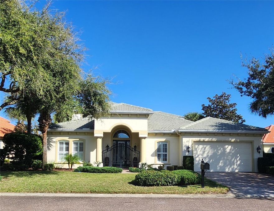 JUST STEPS AWAY FROM THE BEACH in the private golf community of Ocean Hammock, this beautiful home is a MUST SEE !! Traditional Charm & Understated Elegance can best describe the design & detail of this IMMACULATE, LAKEFRONT home. Custom built in 2006 with some unique features that give it that "WOW" factor, you'll be hard-pressed to find another one like it! A neutral palette of complimentary wall colors, upscale lighting & window treatments, 8’ raised panel doors, and gorgeous cherry hardwood floors set the stage for a tasteful, timeless design throughout the home. Upon entry there’s a clear sightline to the back of the house, lending a sneak peek at what’s to come! Behind the double doors to the left is one of the bedrooms (with its own bath), utilized as a home office. The formal living & dining space is dressed to impress w/ soaring ceilings, stately columns, crown moldings, beautiful trim work and an amazing, coffered ceiling! The fireplace creates a warm & inviting atmosphere, and the adjacent dining room can accommodate a large gathering when entertaining guests. NEXT, your eyes are immediately drawn to the stairway with iron spindles & wood rails leading up to the LOFT LIBRARY. But wait…the KITCHEN is the REAL SHOW STOPPER! Dark wood cabinetry spans the entire side wall, and small sections of block glass set in the backsplash allow the sunlight to sparkle on the granite counters. The upscale stainless appliances, range hood and GAS grill-top stove make you stop & take notice, while the wall ovens and large center island just might entice you to stay home & cook! Adding to the appeal is a built-in desk area, large breakfast nook w/ mitred glass picture window, and ANOTHER center island BAR with sink & icemaker! NOT TO BE OVERLOOKED is the oversized double door refrigerator, walk-in pantry, AND a fabulous Butler’s Pantry with the same tasteful granite & wood cabinetry w/ glass doors to display your finest dinnerware! The family room has its own touch of WOW, showcasing a double set of sliding glass doors that open from the corner creating a large opening to the lanai, presenting an unobstructed water view and seamlessly bringing the outdoors in! THE LANAI is a definite contender for THE MOST FABULOUS FEATURE!! Covering the full width of the house & wrapping around the side, this space offers SPECTACULAR WATER VIEWS, and is a great place to relax & unwind or enjoy the company of family & friends. The primary en-suite is on the main level and is quite spacious w/ seating area, access to the lanai, and an amazing walk-in closet that’s custom configured for organizational storage. The bath is well-appointed with two large separate vanities, a luxurious garden tub, oversized shower and private water closet. Another custom design feature is the unique & convenient connection from the primary en-suite directly into the laundry room (with a separate entrance from the house). Every bedroom is an En-Suite, and there's a powder room on the main floor as well. The upstairs bedrooms are separated by a gathering space in the loft, and a covered screened-in balcony with more beautiful views! The oversized garage is approx 30 x 18 and has additional storage space, with access to the attic as well. *The freezer and wine frig under the stairs, the firepit on the lanai, and the invisible fence surrounding the property will all convey with purchase. *Water Heater, Fireplaces, Cooktop & Outdoor Grill work on Propane. HVAC=2017 (2 units, 4 zones).