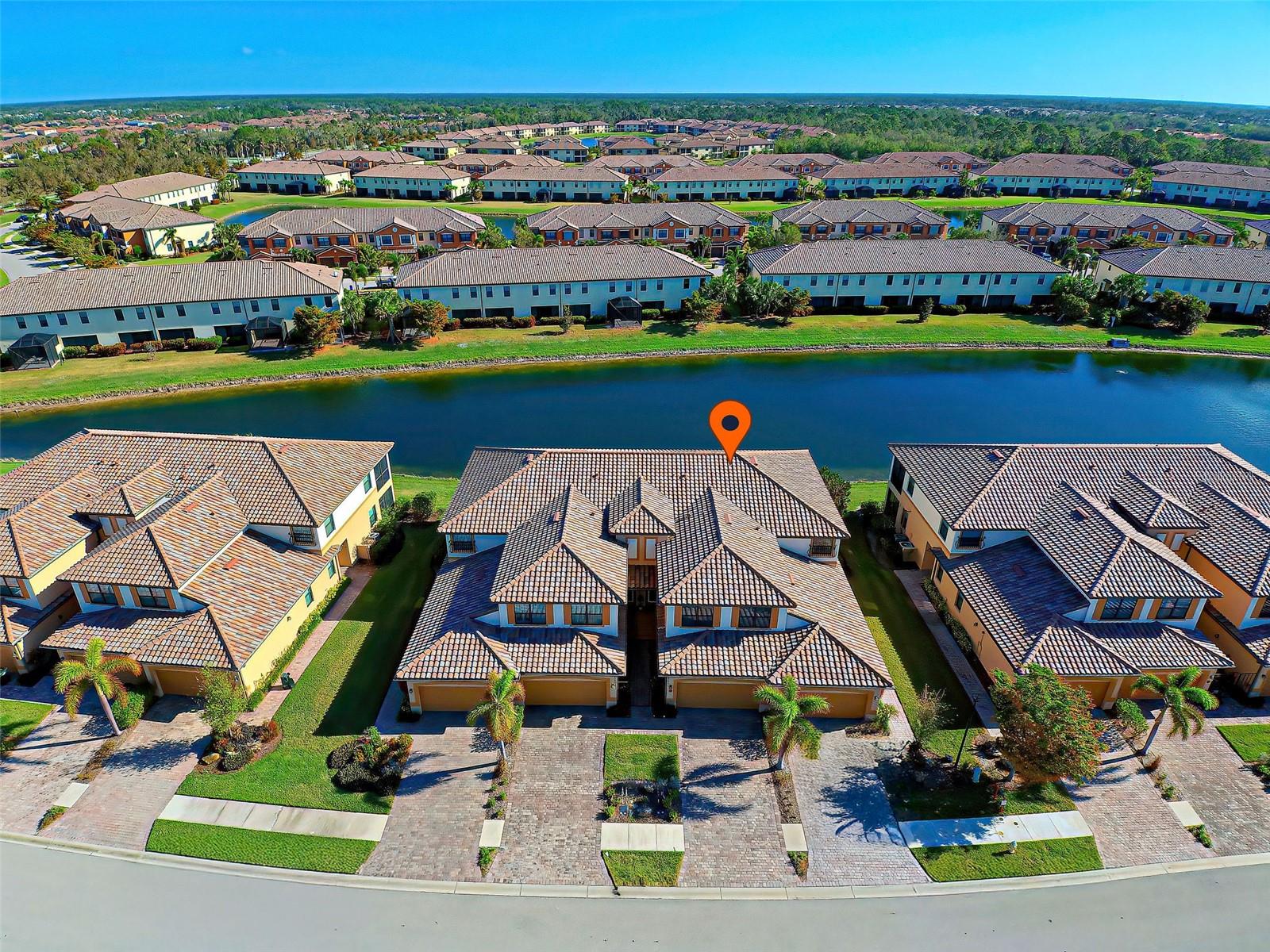 MOTIVATED SELLER / FULLY FURNISHED / THIRD QUARTER HOA DUES PAID BY SELLER - Luxury condominium with water view located in the gated, amenity-rich community of GRAN PARADISO less than one mile from DOWNTOWN WELLEN PARK. OPEN FLOOR PLAN consists of a large living and dining area open to the kitchen, and expansive lanai with a water view. The spacious primary suite features double, oversized WALK-IN CLOSETS, ensuite with dual sinks, walk in shower, garden style soaking tub and water closet. The SPLIT FLOOR PLAN separates the 2nd and 3rd bedrooms, bath, and laundry. The kitchen is well equipped and boasts of stainless-steel appliances, stainless steel sink, solid wood 42” upper cabinets, brushed nickel hardware, breakfast bar and breakfast nook. Coffered ceiling, decorative molding, tile floors set on the diagonal, separate laundry room, IMPACT RATED WINDOWS throughout (no need for shutters!) and IMPACT RATED GARAGE DOOR are just some of the many upgrades that add ambiance and function to the home. The THREE-CAR TANDEM GARAGE also has ample space for golf cart, workshop or hobby area! ADDITIONAL STORAGE located under stairway as well as attic. RECENT UPDATES and maintenance include - Roof Inspection with added insulation (2023), Roof Cleaned (2023), New Landscaping (2024), Lanai Painted (Jan 2024). Gran Paradiso offers a resort pool with zero entry, fitness center, walking trails, billiard / poker game room, library, grand Tuscan inspired clubhouse with spa, sauna, steam room, tennis courts, pickleball, playground and function rooms. Clubs and organizations abound and can be accessed through the full-time activities’ director. The quarterly dues include cable and internet, landscaping maintenance, irrigation and landscape pest control, and exterior building maintenance. Annual CDD is included in taxes. Gran Paradiso is located in the West Villages District of Wellen Park and is less than a short one-mile walk, bike ride or golf cart ride to the new Downtown Wellen Park with unique shops, fine restaurants, Sunday Farmer’s Market, Friday night live entertainment on the green and more! To be sold FULLY FURNISHED / TURNKEY