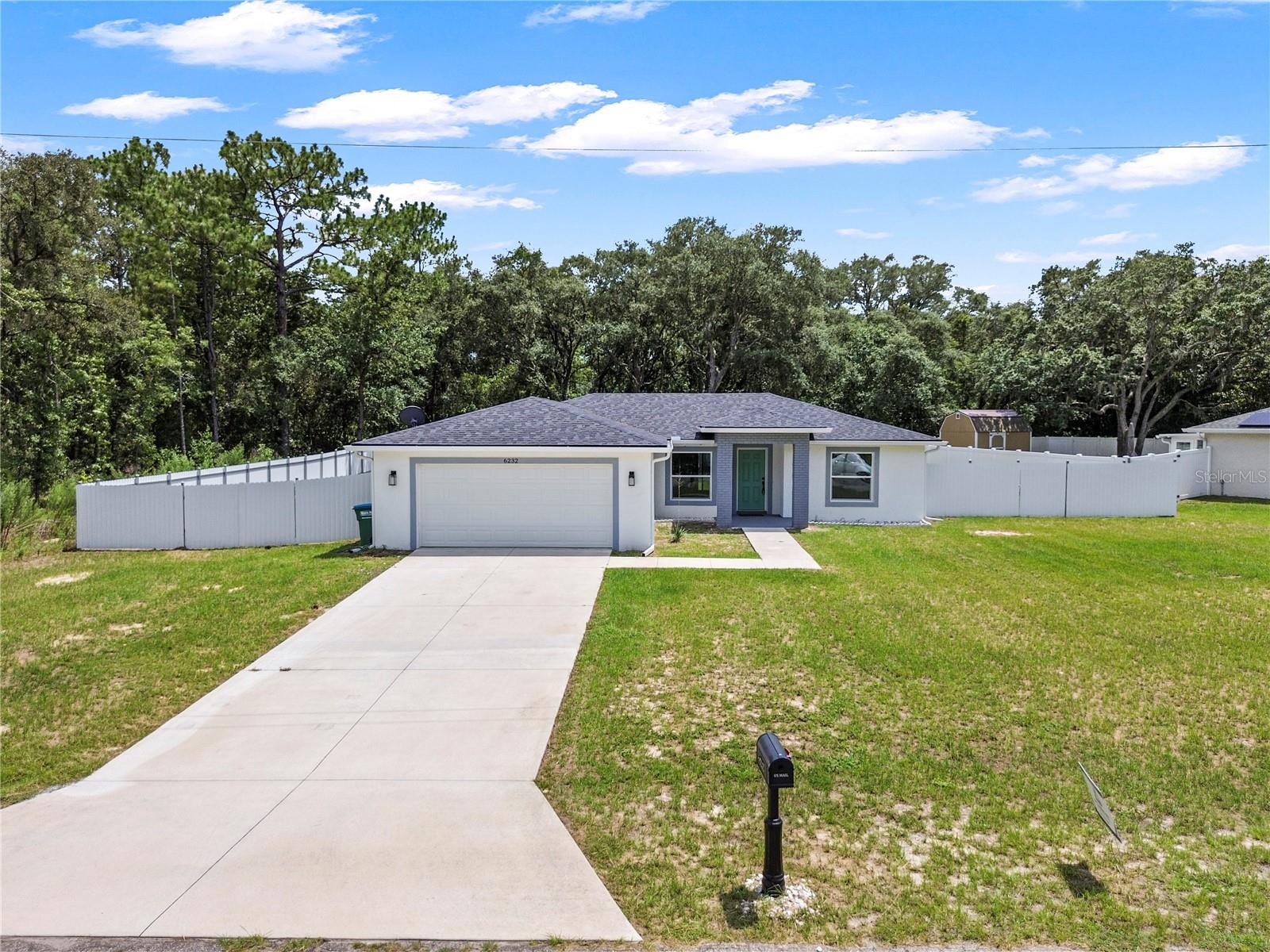 Now available for rent: this solid 3-bedroom, 2-bathroom home in Marion Oaks was built in 2022 and offers modern features in a quiet Ocala neighborhood. It has an open floor plan with vaulted ceilings, no carpet, and a spacious kitchen with quartz countertops, stainless steel appliances, tile backsplash, and soft-close cabinets. The primary suite includes a big walk-in closet, double sinks, and a walk-in tiled shower. You’ll also get a laundry room, covered back patio, and a 2-car garage. The fenced yard and no HOA make it even better. Located just minutes from I-75, shopping, and dining. Contact us to schedule your showing!