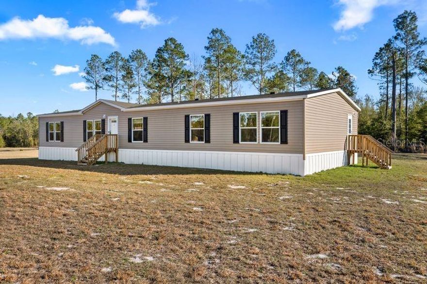 Brand New GAMETIME MODEL 4BED 3BATH 2254 sqft This Corner 4.4 acres of a prime residential lot in Pine Meadows. The beautiful lot sits high and dry! This HOME features open Living and dinning room along with an Island Kitchen with Pantry - LRG Activity room- can recess lights - Garden tub- Walk n Showers- Walk n Closets- His & Hers sinks- Home Factory Warranty and more. Come check out this new model