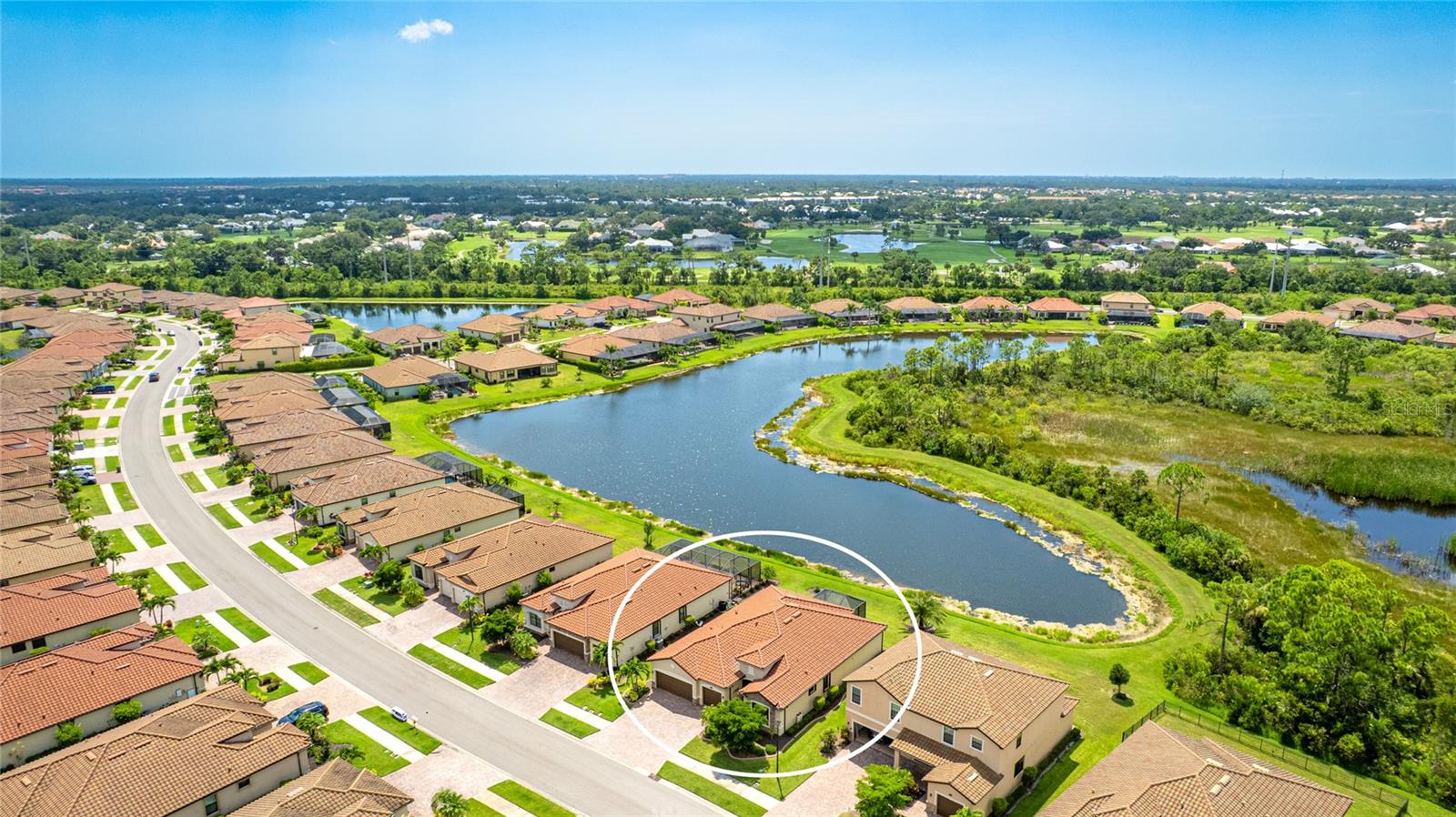 EXCEPTIONAL, STUNNING VIEW! Check out this gorgeous home situated with a serene and private view of a pond with preserve beyond. Discover a rare opportunity to own a stunning 2,444 sq. ft. Summerville plan home with nearly $130k in homeowner enhancements. The floorplan is one of the, if not THE, most coveted home designs in Gran Paradiso and Wellen Park, Florida. It is an exquisite 3-bedroom, 3-bathroom plan, complete with a versatile den and a spacious 3-car garage, a masterpiece of modern living. The open-concept great room design seamlessly connects the living spaces, perfect for both entertaining and everyday comfort, while the gourmet kitchen boasts a massive island and state-of-the-art appliances, including a recently upgraded glass-top induction range. A grand double-door entry welcomes you into this elegant home, featuring stylish porcelain tile flooring throughout for durability and easy maintenance. There are granite countertops in the kitchen and all bathrooms, a fabulous extended lanai to enjoy the exceptional view, storm screen & shutters added for hurricane protection, window film for energy efficiency, closet organization systems, enhanced landscaping, decorative carpentry, and an added home water purification system. The interior was recently painted with high-quality, washable paint throughout the living areas and kitchen, freshening the home and making it truly move-in ready. Nestled in one of the most serene and scenic spots in the neighborhood, this home backs up to a tranquil lagoon-style water view and lush preserve, offering unparalleled natural beauty and privacy. Located just minutes from Wellen Park’s vibrant amenities, including shopping, dining, and entertainment, and only a few miles from pristine beaches, this home perfectly balances peaceful retreat with urban convenience. Enjoy access to Gran Paradiso’s resort-style amenities, including a clubhouse, pool, and fitness center. Rarely available, this Summerville floorplan is your chance to own a luxurious home in an idyllic setting—schedule a showing today to experience this exceptional property!