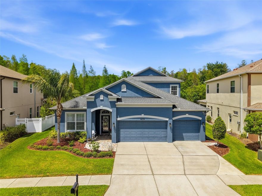 Welcome to 4079 Windcrest Drive in Wesley Chapel, Florida, an exceptional pool home in an established community that could easily function as a MULTI-GENERATIONAL retreat, offering bedrooms, bathrooms, and
multiple living spaces on both floors. With over 3,500 square feet, 5 bedrooms PLUS a dedicated OFFICE and FLEX ROOM, and 4.5 bathrooms, there
is truly room for everyone to live comfortably while still enjoying privacy. The heart of the home features a spacious kitchen with granite countertops and stainless steel appliances, seamlessly connecting to the main living
areas with TWO DINING AREAS—ideal for entertaining. The bathrooms have been tastefully updated with quartz countertops, and the entire home reflects neutral, modern tones that fit
today’s style preferences.This home is immaculate and pristine with no visible wear and tear. Step outside to your PRIVATE OASIS—this property offers a SALTWATER POOL, an extensive covered lanai, and a
fully FENCED, incredibly private backyard. LOCATION is where this home
truly shines. You are within walking and biking distance to the ELEMENTARY SCHOOL and a brand-new LIBRARY, making daily routines easy and family-friendly. Just minutes from I-75 and I-275, commuting is a breeze,
and you’re surrounded by restaurants, shopping, and conveniences—including The Shops at Wiregrass and Tampa Premium Outlets. Hospitals and medical facilities are just a few miles away, and a new state-of-the-art
YMCA is being built nearby. Living in Seven Oaks means access to resort-style amenities that are second to none—featuring a CLUBHOUSE with a CAFE, FITNESS CENTER, private MOVIE THEATER, and event
spaces. Enjoy the WATER SLIDE, lap pool, kids’ splash pad, plus basketball, tennis, pickleball courts, playgrounds, and year-round community events and after-school programs. Homes like this—with SPACE,
CONDITION, LOCATION, and FLEXIBILITY—do not come around often, especially at this value. Schedule your private showing today and experience firsthand why this should be your next home. Sellers are providing a COMPLIMENTARY HOME WARRANTY for the new owners!