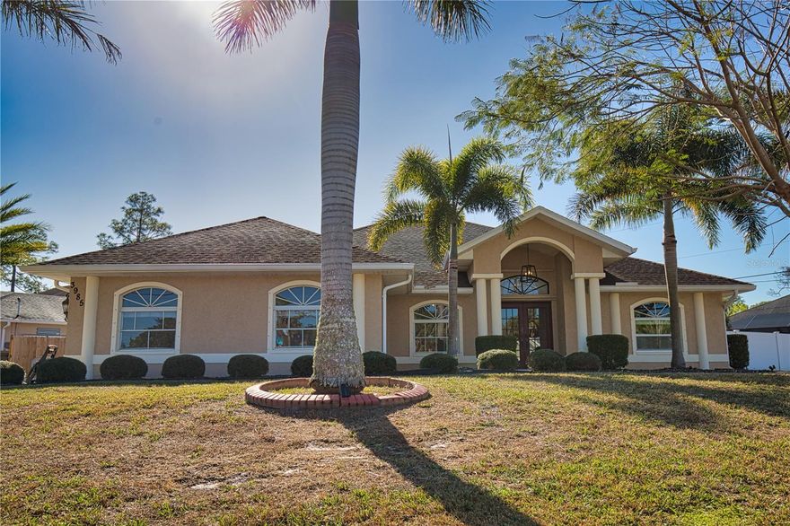 Set on an oversized corner lot, this well-maintained 3-bedroom, 2-bath single-family home offers 2,306 square feet of comfortable living space. This home opens to an expansive living area complete with fireplace for cozy evenings. The kitchen, with extended countertop for casual dining, also has ample room for the whole family to gather around the dining table. Adjacent to the kitchen is area that could be used for more formal dining, a sitting area, or anything else you can envision. The primary bedroom features a large walk-in closet and en-suite bathroom with updated shower, and french doors leading to the outside. The split floor plan hosts two well-sized bedrooms and full bathroom offering space for family or visitors. Vaulted ceilings and porcelain tile flooring throughout create an open, cohesive feel, while french doors from both the living room and primary bedroom lead to an inviting outdoor living area.

The beautifully landscaped, privacy fenced backyard is designed for both relaxation and entertaining, featuring a paved lanai with pergola, spa, and outdoor kitchen. Additional exterior features include a storage shed, a spacious attached two-car garage and additional parking suitable for RV or boat. Recent updates include fresh interior and exterior paint, updated showers in the bathrooms, new HVAC 2023, and water heater 2022. 

Conveniently located near I-75, shopping, restaurants, and Gulf beaches, this property combines privacy, functionality, and accessibility in a desirable setting.