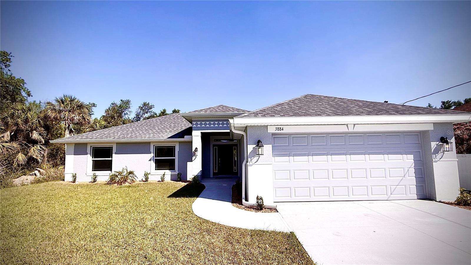 CHECK OUT THIS MOVE-IN READY HOME!! This beautiful 3 bedroom 2 bath home includes a flex space and two car garage. This home includes tile in all areas except the bedrooms. An amazing kitchen with granite countertops and stone gray cabinetry. The primary bath features a large tub and separate tiled shower upgrade. What a great place to call home. All of the conveniences of North Port with city water included.