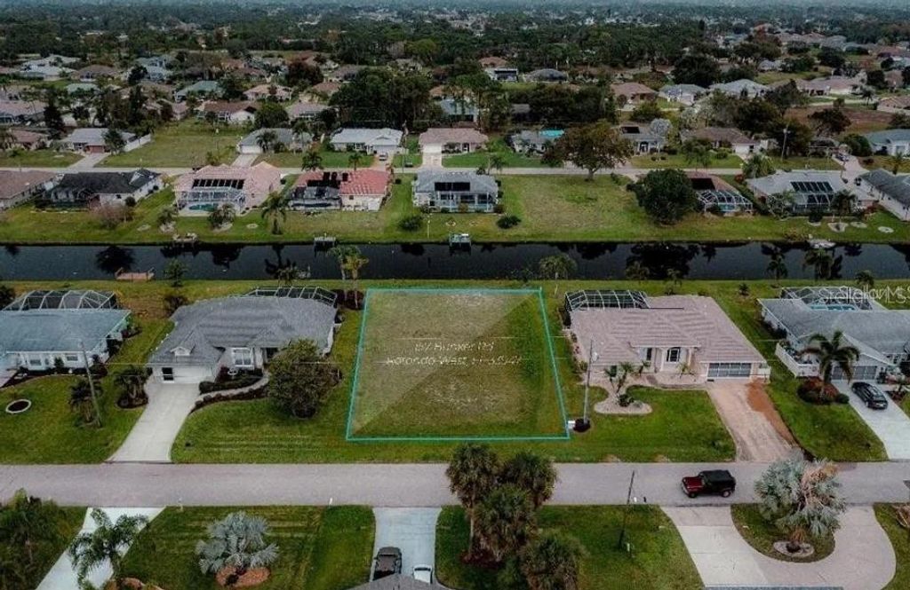 Photo of 157 Bunker Road, Rotonda West, FL 33947 (MLS # O6327884)