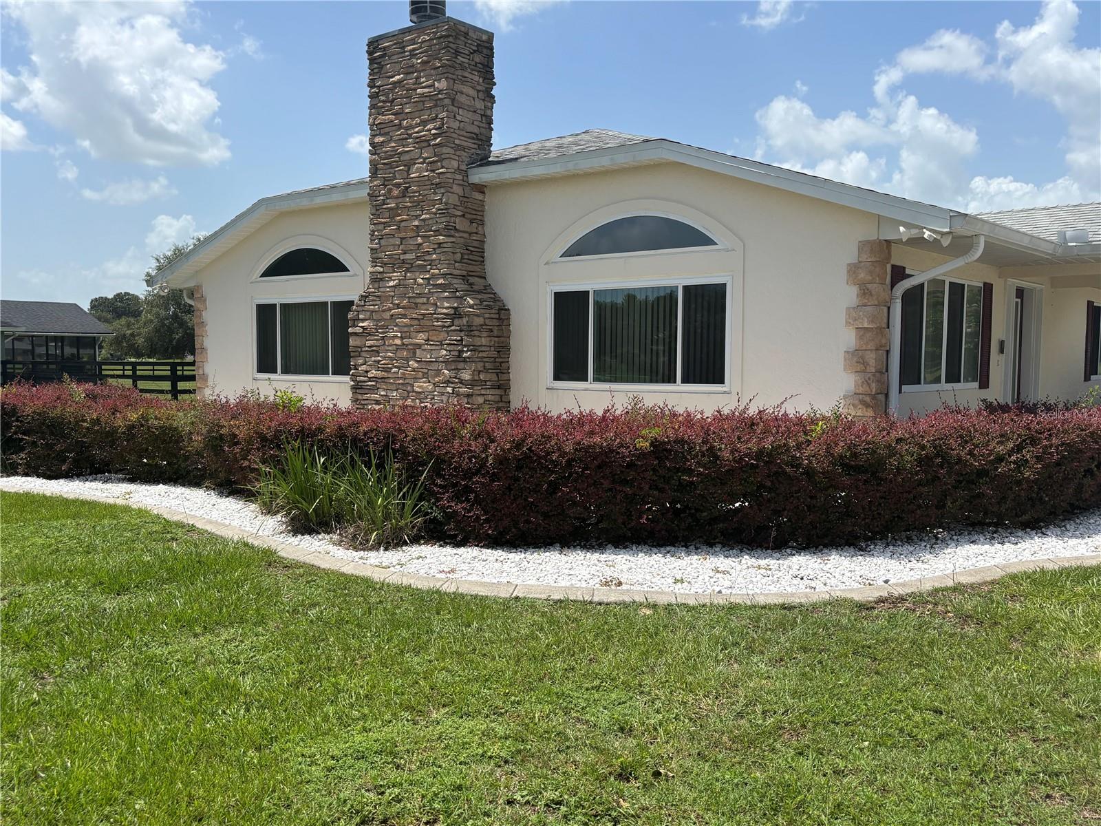 Welcome to the highly desirable Golf Park Estates Community! This well-kept 3-bedroom, 2.5-bath home sits on just over an acre of partially fenced land and even includes an extra bathroom in the spacious 4-car garage. The kitchen boasts a center island with a breakfast bar, wet bar, and a large pantry. Relax by the cozy stacked stone gas fireplace or unwind in one of two jetted Soaking tubs. The primary bedroom features a stunning walk-in cedar closet. Both bathrooms include dual sinks, jetted soaking tubs, and separate walk-in showers. Additional highlights include a security system, exterior security lights, gutters and downspouts, a screen-enclosed patio, exterior gas hookups for grilling, solar tubes for natural lighting, an indoor office/utility room, and newer roof, AC, and water heater.
