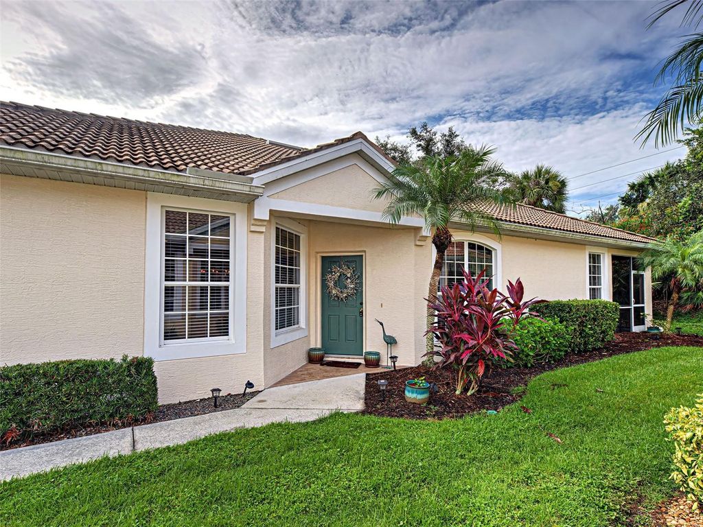 Photo of 4911 Whispering Oaks Drive, North Port, FL 34287 (MLS # C7514021)