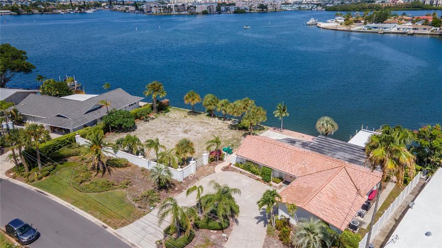 If you are looking for waterfront property, your search is over! This property is being sold as a package with the adjacent house. Please see MLS #  U8250458. Your options are endless: you can live in the existing house and build on the adjacent lot, knock down the current house and combine both lots for a larger estate, or build on both lots.  The seller will not be making any upgrades, as the property is being sold as-is. The sunsets from your back patio are breathtaking, offering a perfect end to each day. The seawall on each lot is approximately 93 feet & 5 inches  long.