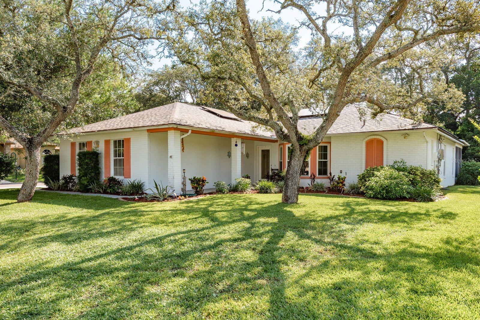 This beautiful 2/2 updated home in the very popular Timber Pines neighborhood is located near all the restaurants and shopping in Spring Hill, in a 24 hour gated community. It's on a corner lot with a 2-car garage and lots of storage! It's spacious with1788sf and 2700sf under roof!! Electric solar panels are paid for at closing, saving you on your electric bill each month! Kitchen has wood cabinets and granite counter-tops, remodeled beautifully along with the bathrooms. Lovely shower in the master bath! Split floor plan with walk-in closets, the master bedroom has 2 walk-ins! Gorgeous luxury wood flooring and tile throughout most of the home. 3 sliders leading from the bedroom, living room and kitchen to the large enclosed back porch. The kitchen has a breakfast nook and there is a spacious dining room, too! Laundry room is just off the family room leading to the 2 car garage. This home is priced right and ready to move in! iMap has it currently valued at $320,078!!! You're close to Weeki Wachee with the mermaids and springs! Boating, paddle-boarding, kayaking, swimming with the manatees, all the outdoor Florida living and just a few minutes away! You're just about an hour away from the Tampa International Airport with the Suncoast Parkway about 15 minutes away! Timber Pines is an active country club subdivision that features resort-style amenities which are completely owned by the Association. It is debt free and has low HOA fees! The neighborhood has 4 golf courses (Championship and executive) complete with practice range, chipping and putting greens, the country club has both casual and fine dining, a beautiful bar, 2 swimming pools with spas, pickle ball and 8 tennis courts lit up for night play, 2 dog parks, a wellness center, resident activity center, and a Performing Arts Center. Activities include arts and crafts, woodworking, billiards, bocce, yoga, boot camp and over 100 clubs! Weekly scheduled events include quilting, pottery, painting, mahjong, bridge, poker, plus more! Schedule your showing today!