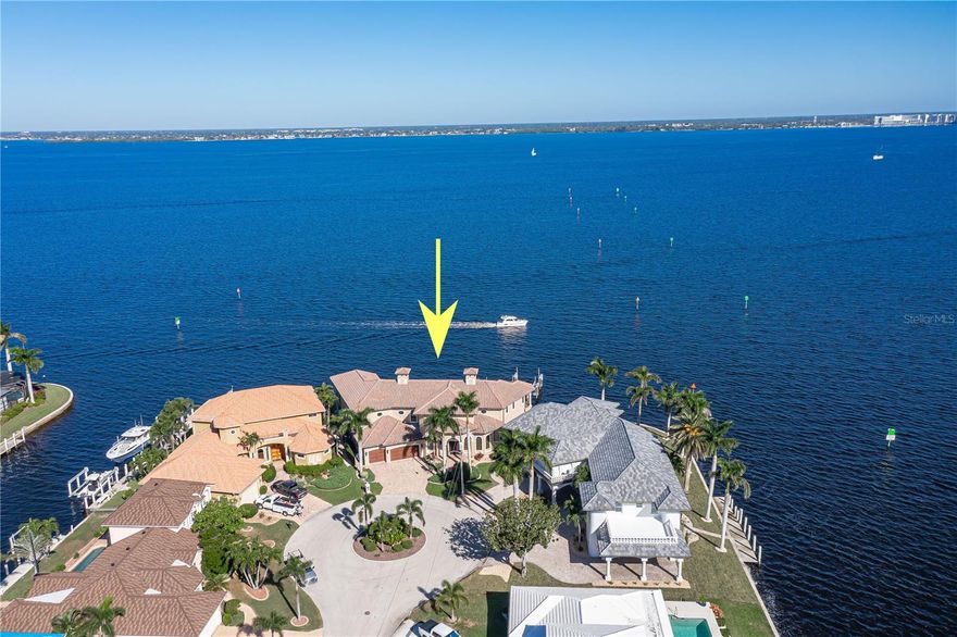 PHENOMENAL HARBOR VIEWS FROM THIS CUSTOM, TWO-STORY HOME W/173 FT OF SEAWALL & TWO DOCKS.
