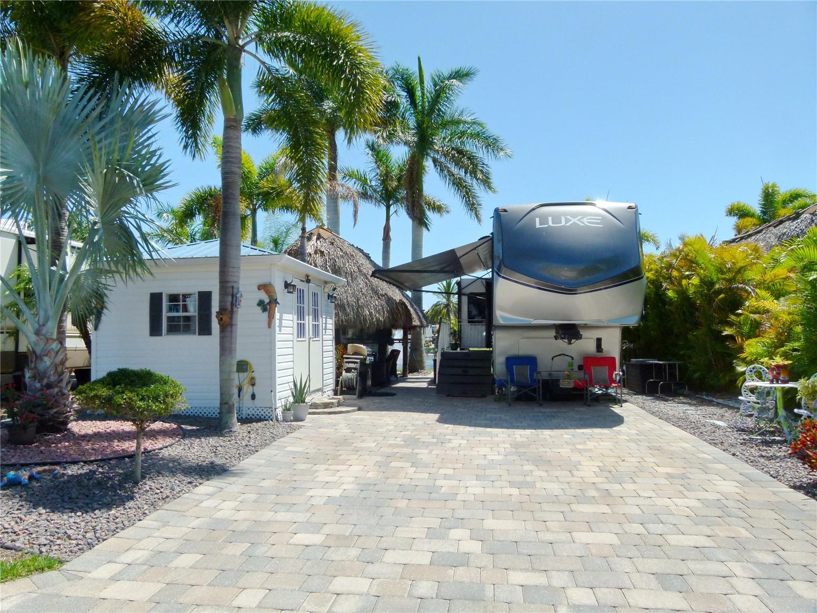 Silver Palms RV 5 Star Resort, Beautiful property on the pond which you can enjoy the sunsets, a Tiki which was rethatched 2023, includes patio furniture, pavers 12 x 10 Casita with electric and plumbing, washer, dryer, refrigerator, hot water heater. Composite steps for RV which stays, the landscaping is exquisite and the pavers are 1600 square feet. The RV, Luxe, can be included in the package. The 2015 Luxe RV is available for 70,000. There is a his - her closet, full size refrigerator, King Size bed, W/D hookup, 42' long. This is such a Paradisiacal environment.
Please come and take a look.