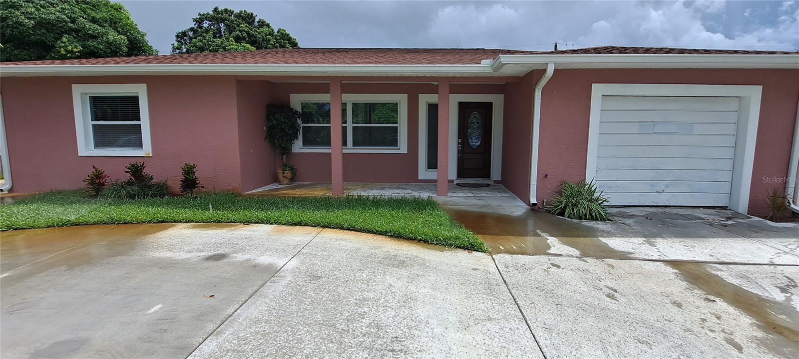Centrally located in the desirable Harshaw subdivision of North St Pete, this remodeled block home has 3 bedrooms and 1 bath in the main house plus a Studio room and an In-law Suite for a total of 5 bedrooms and 3 baths. Extra rooms are perfect for a large family, home office, or additional rental income. You will love all the upgrades in this house, including porcelain tile floors throughout, interior and exterior paint, updated bathrooms, wood kitchen cabinets with a granite countertop and glass backsplash, and newer double-pane windows. Whole-house water softener included. The huge screened-in and covered back porch is great for outdoor family fun and relaxation. The house features a shed in the backyard and is accompanied by beautiful landscaping, mature grass, and a sprinkler system. Non-Flood Zone, No HOA, No Deed restrictions. A/C & Roof replaced in 2017, new back porch in 2022. Tremendous parking availability with a new 6-inch thick heavy-duty circular driveway in 2020, and additional parking on the side of the house. The house is located in a prime location, only a few miles away from downtown St Petersburg and the Gulf Beaches. Don't miss the opportunity to call this property home. 3 apartments are currently rented, with 2 more available for higher rental income. Live in the main house and rent out the 4 apartments if you prefer. Rental income pays mortgage.