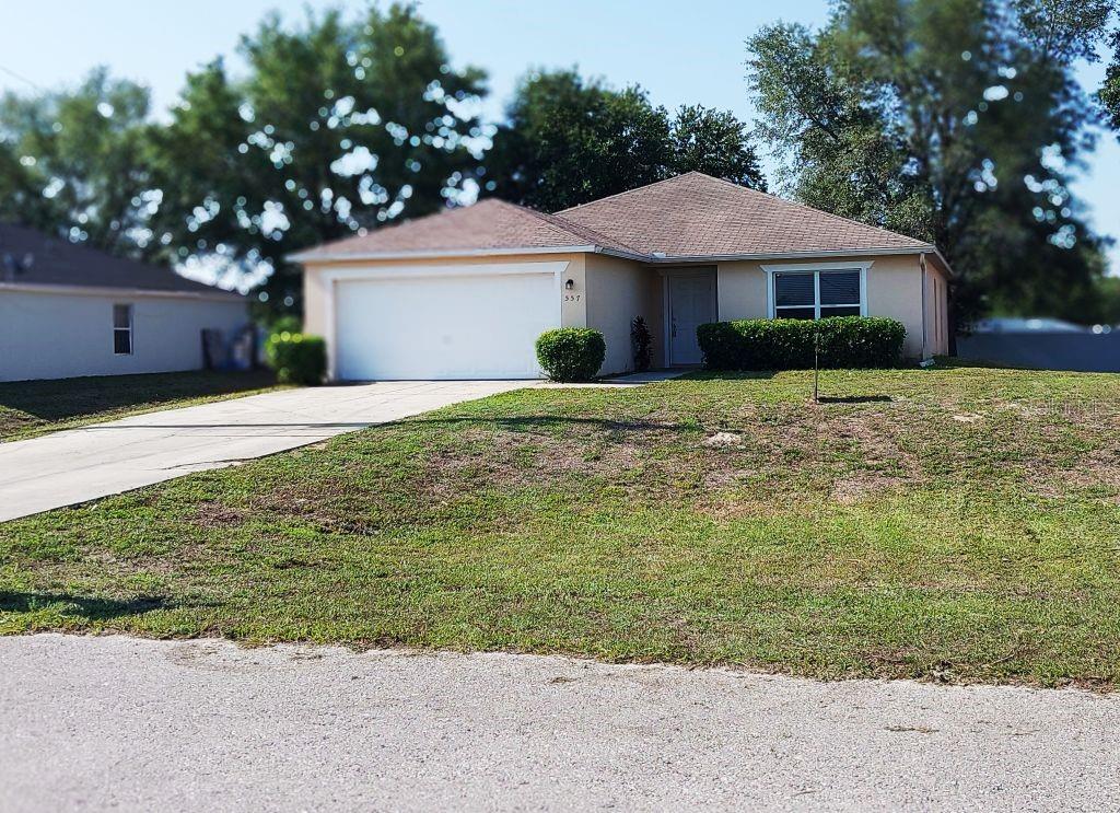 Photo of 557 Windermere Drive, Lehigh Acres, FL 33972 (MLS # TB8542017)