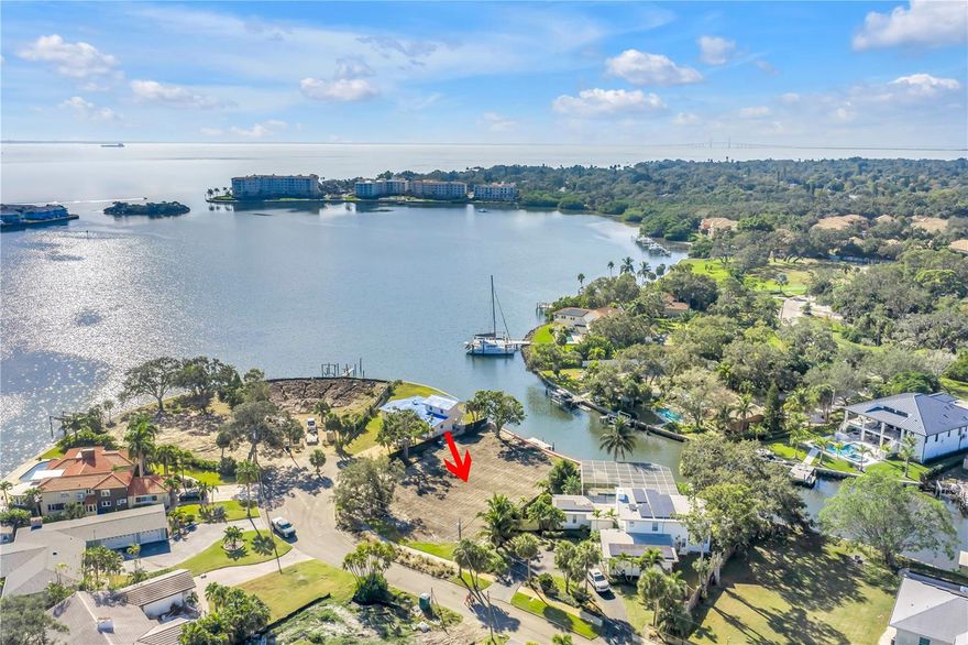 Discover an exceptional waterfront opportunity on scenic Paradise Way in Southern St. Petersburg. This rare, over-sized vacant residential lot sits directly on Little Bayou and offers un-restricted, deep-water access to Tampa Bay—an ideal setting for boaters and waterfront enthusiasts.
Recently cleared and measuring approximately 135 feet wide by 128 feet deep (0.39 acres), this expansive parcel can easily accommodate a large estate-style home. Located on a quiet cul-de-sac, the property enjoys gentle bay breezes, a peaceful sense of privacy, and a protected position that still captures beautiful, wide-open water views.  Key improvements have already been completed, including a newer seawall, full demolition, a soil report, and a current survey—making this a smooth and ready canvas for your builder of choice.  Just minutes from Downtown St. Petersburg, the Marina District, I-275, and the world-class Gulf Beaches, this premium homesite blends tranquility with incredible convenience. Whether for a custom luxury residence or a modern coastal retreat, this Paradise Way lot is the perfect place to bring your dream home to life.