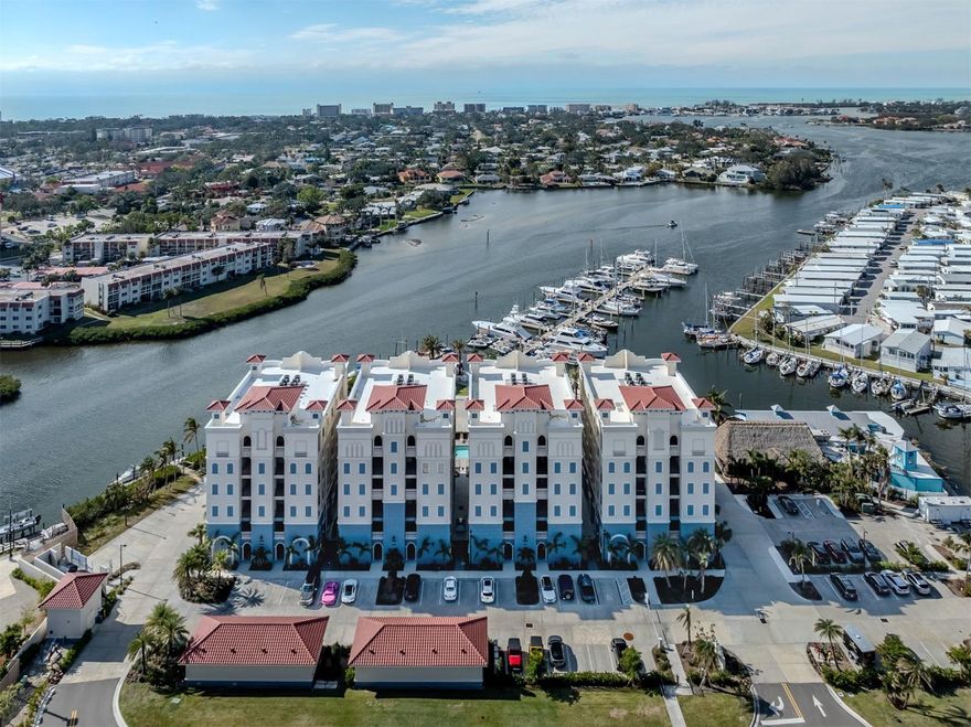 Welcome to The Jewel of Porto Vista! Nestled in the exclusive waterfront community of Porto Vista, this modern 5th-floor condo boasts breathtaking Intracoastal and Roberts Bay water views. Built in 2023, it features upgraded appliances, solar screens on the lanai, stylish cabinets, and luxurious flooring throughout. Enjoy the best of coastal living with plenty of natural light, an open and airy layout, and gorgeous sunsets from your own home. The condo is part of a gated community with top-notch amenities, including security, a heated community pool, and a private garage. Guests will love the added convenience of private guest parking. Next door, indulge in fine dining at Dockside Waterfront Grill or explore the Fisherman's Wharf Marina, offering flexible boat slip leasing, boat rentals, fishing, and kayaking adventures. Porto Vista is ideally located near historic Venice Avenue, Venice Beach, and the Legacy Bike Trail. Plus, it’s just a short walk to the charming downtown Venice, with its unique shops, dining spots, entertainment, and vibrant nightlife. This is coastal luxury at its finest—don’t miss out on this rare opportunity!