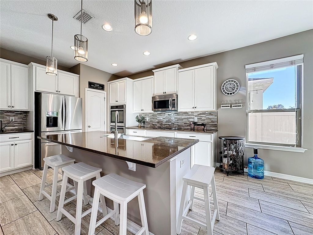 Photo of 1234 Fountain Coin Loop, Orlando, FL 32828 (MLS # O6363890)