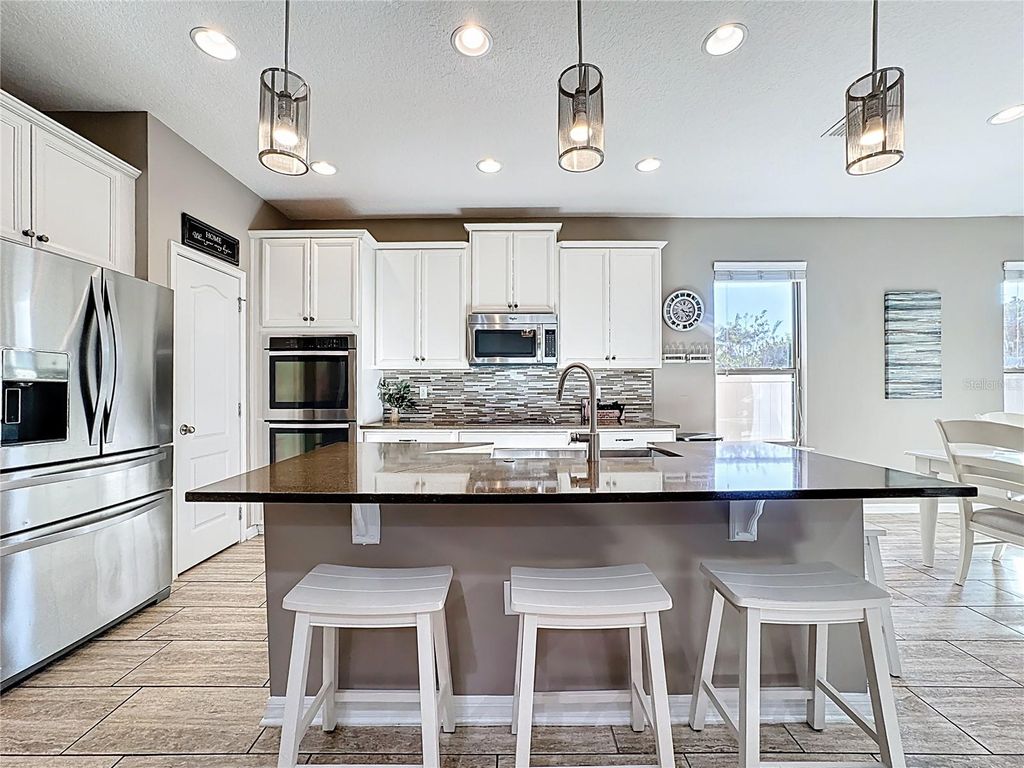 Photo of 1234 Fountain Coin Loop, Orlando, FL 32828 (MLS # O6363890)