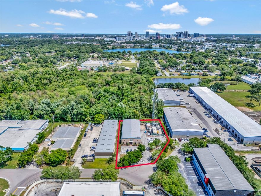 This versatile Office-Warehouse property boasts immense potential and occupies a highly sought-after, high-visibility location with a High Flow of Traffic in the heart of Orlando! If LOCATION and CONVENIENCE is a MUST this commercial property is exactly what you are looking for.  Located in a Business Commerce Center, off S. John Young Parkway, the location is Minutes to Downtown Orlando, as well as all the major highways and tollroads such as the 408, I-4 and turnpike. Situated on .84 acre lot thats fully secured and fenced, the building consist of a 2,580sqft of finished office space that includes 8 offices, 1 conference room, 1-kitchen, 3 bathrooms, and a large reception area. Also attached to office is a Fully Built functional 5,640sqft warehouse that has 3 large loading bays ground level and equipped with Commercial Industrial Storage Racks and shelving throughout that will convey. Building has a secured hard wired security system and also has a Generac back up generator that will run the whole building in case of a power outage. The property was constructed with a 2nd floor in mind above office that could give you an extra 2,580sqft if needed. The property's expansive size allows for plenty of parking, and currently has 21 parking spaces and plently of room for deliveries and all your storage needs. The possibilities are truly limitless! This is a Great investment opportunity all around.