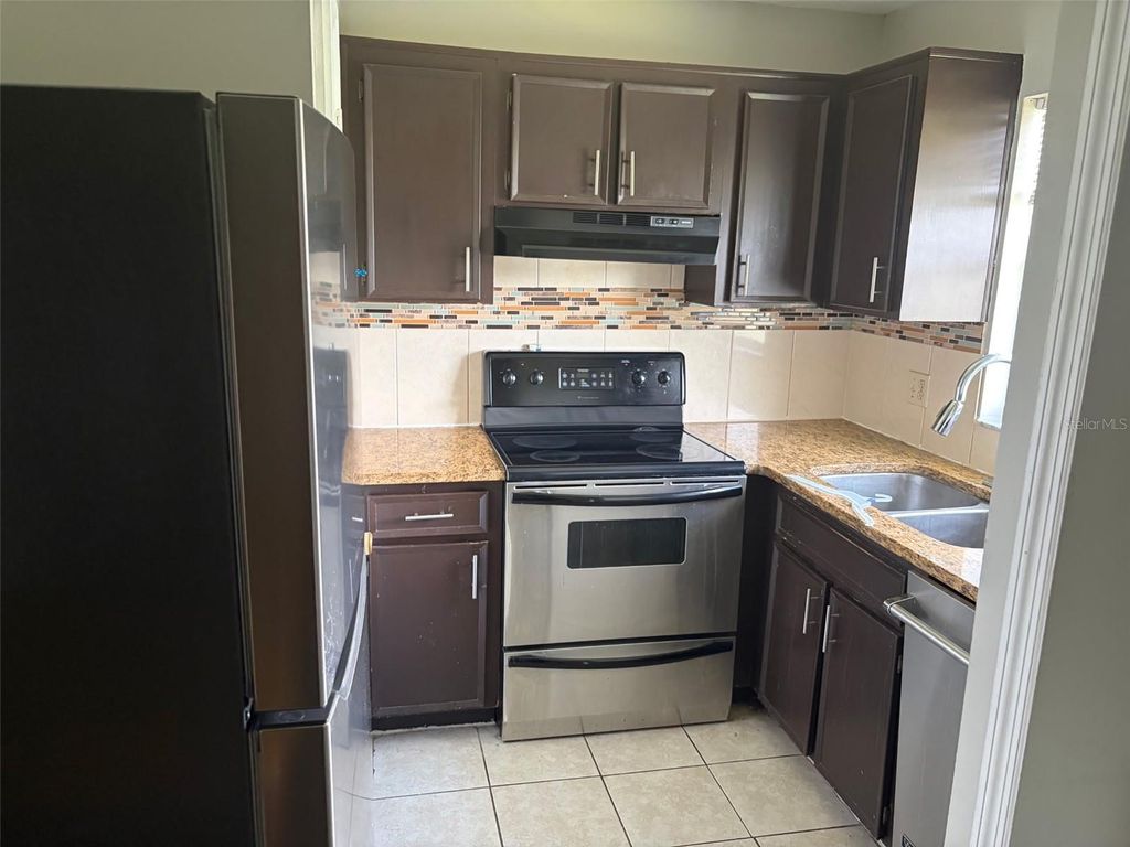 Photo of 4314 Pershing Pointe Place #7, Orlando, FL 32822 (MLS # O6405621)