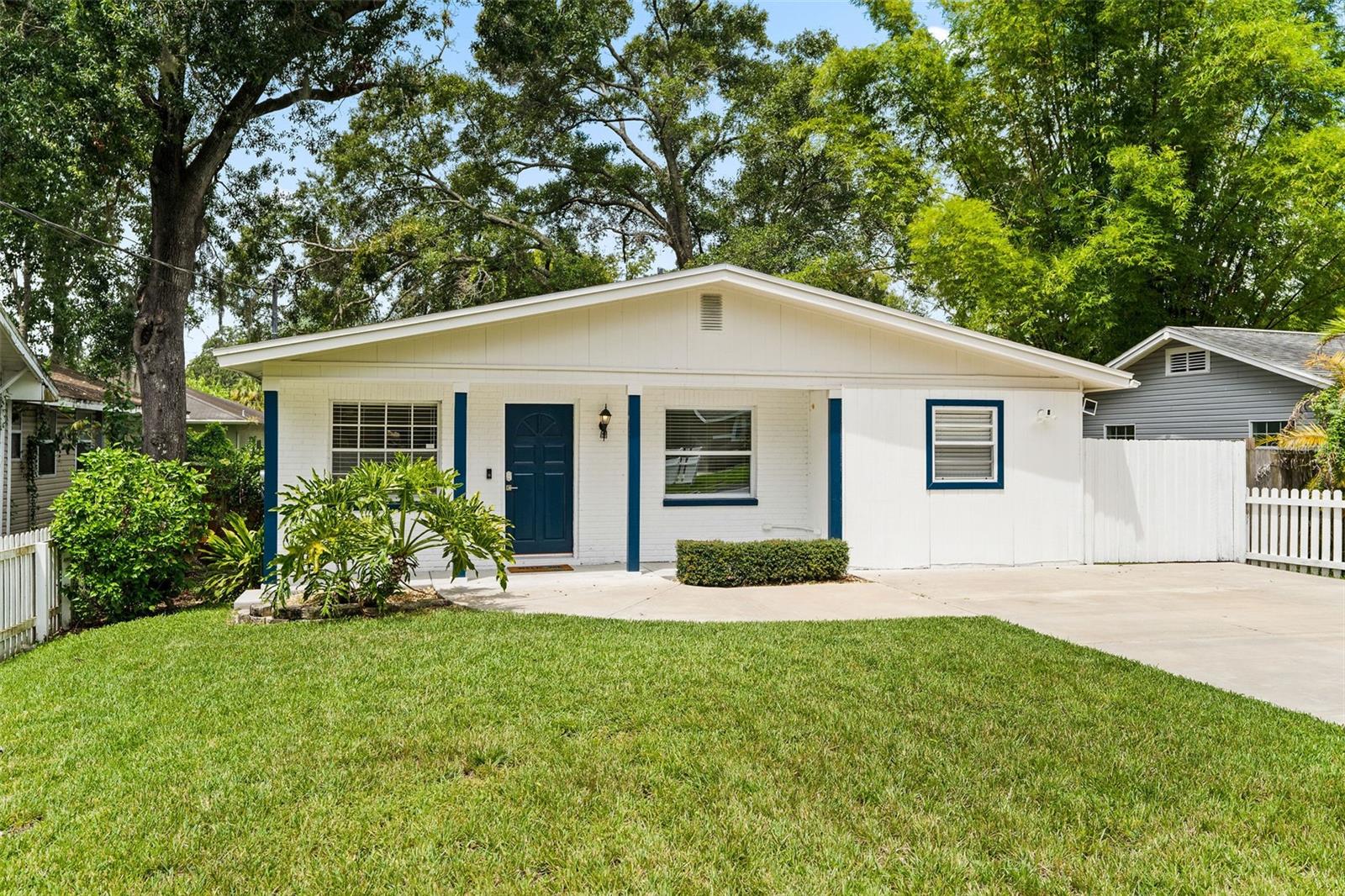Welcome home to Old Seminole Heights, a vibrant neighborhood renowned for its amazing local businesses, award-winning restaurants, and charming historic homes. This delightful house is quietly situated near the serene Hillsborough River and Lowry Park Zoo and just minutes away from popular attractions like Armature Works, Amalie Arena, Raymond James Stadium, and Riverwalk. Outdoor enthusiasts will love the easy access to the bay, perfect for boating, paddle boarding, canoeing, and kayaking. The layout of this home is exceptional, featuring a bright living room that flows into a large, open kitchen. The home boasts waterproof laminated flooring throughout. The beautiful kitchen is equipped with newer cabinets adorned with crown molding, stylish gold fixtures, a quartz countertop, a double sink, and modern light fixtures, making it a perfect space for family gatherings. The spacious fenced yard is ideal for entertaining family and friends. Immerse yourself in the unique vibe and feel of life in Seminole Heights. Roof 2017 AC 2021
