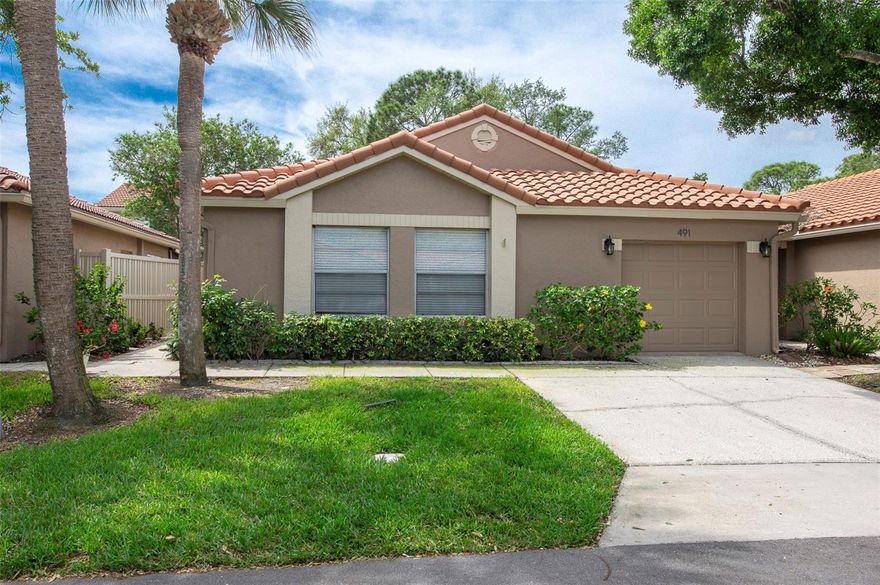 Nestled within the beautiful, gated community of Placido Bayou in Northeast St. Petersburg, this spacious villa is the largest floor plan available and features a thoughtfully added, fully built-out bonus room. Offering 3 bedrooms, 2 full baths, and a one-car garage, the home welcomes you with a charming pavered courtyard perfect for outdoor dining and greenery, complete with an electronic sun awning and pergola covering. Inside, you’ll find new luxury vinyl flooring throughout and a desirable split floor plan. The kitchen is equipped with a refrigerator, range, microwave, dishwasher, and disposal, and opens via sliding glass doors to the private courtyard—ready for your personal updates and design touches. The primary suite features a walk-in closet, adjoining nook, and en-suite bath, while both bathrooms include newer 17" toilets and offer opportunity for modernization. The versatile bonus room can be closed off for privacy and includes tile flooring, ceiling fans, and a built-in office—ideal for remote work or hobbies. The home has never flooded and includes a washer and dryer conveniently located in the garage, which still accommodates a vehicle. This intimate 25-unit enclave offers a unique blend of privacy and community, with a pool, spa, and restrooms just steps away. Residents enjoy scenic sidewalks around lakes and easy access to a tennis club, the Pinellas Trail for biking, nearby shopping, restaurants, and vibrant downtown St. Petersburg.