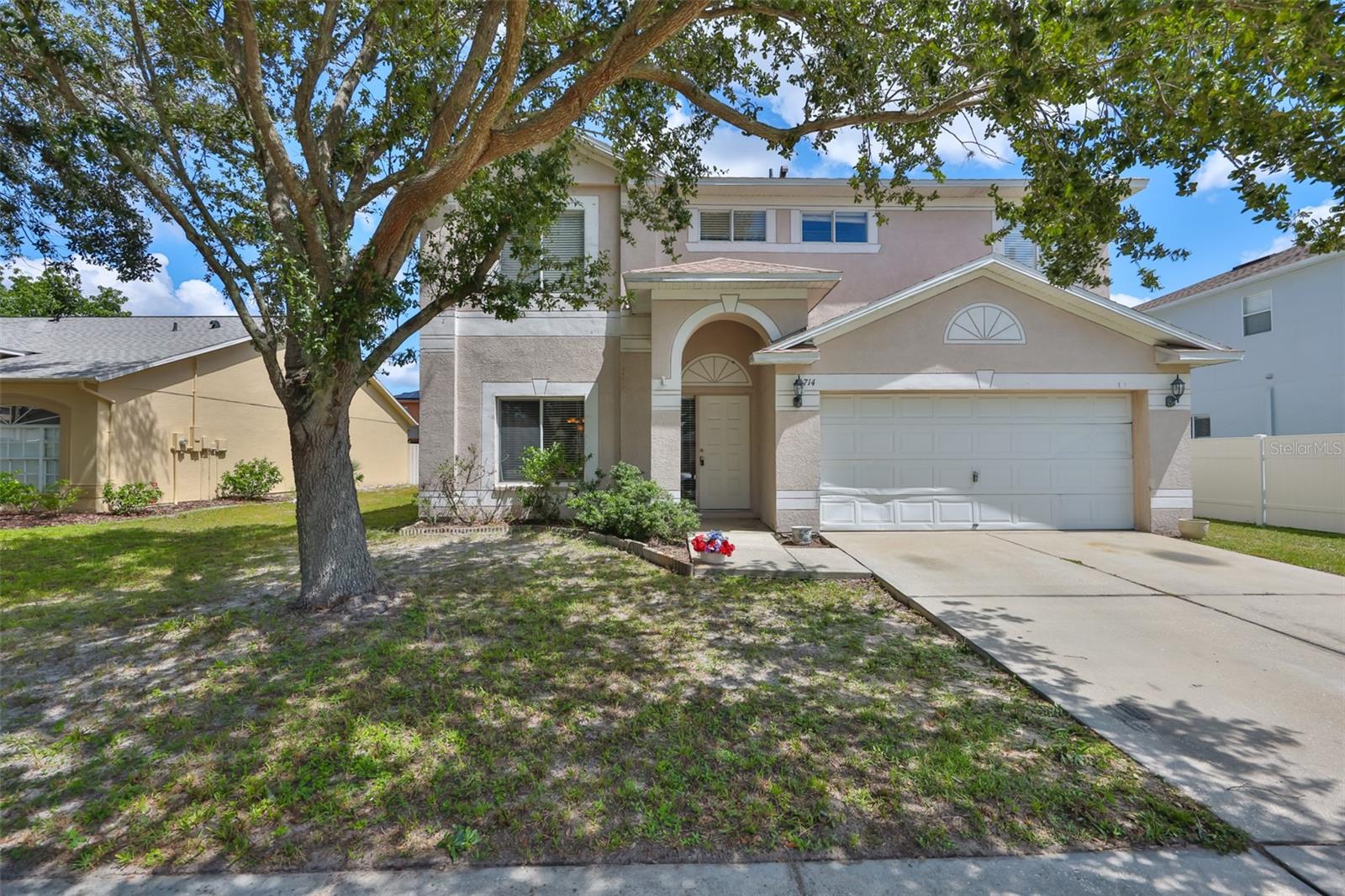 Welcome to this inviting two-story home in the Copperfield subdivision, part of the sought-after Summerfield Village community, where comfort meets convenience in a vibrant golf and amenity-rich setting. Step through the front door into a light-filled foyer that leads to a spacious formal living and dining area, accented with classic chair rail detailing. The kitchen offers abundant cabinetry, a window overlooking the backyard, and a cozy eat-in space that opens to the great room-perfect for gathering with family and friends. A NEW ROOF (2022) provides added peace of mind. You'll also find a large storage area tucked under the stairs for seasonal items or household extras. The first floor is finished in beautiful wood-grain laminate flooring, with vinyl in the conveniently located half bath for guests. Journey upstairs to find a versatile loft-ideal as a playroom, home office, or reading retreat. The primary suite, set apart for privacy, features a generous Ensuite with walk-in closet, dual vanities, a relaxing garden tub, and a separate shower. Two additional bedrooms share a full bath, and the laundry room, complete with washer and dryer, is conveniently located on this level. Upstairs is carpeted throughout the bedrooms and loft, with vinyl flooring in the laundry room and bathrooms for easy care. The oversized two-car garage with built-in cabinets includes a dedicated workshop area for hobbies or projects. The home sits on a large, partially fenced lot that can easily be extended, with a side gate, to a fully fenced yard, offering flexibility for pets, play, or gardening. Enjoy close proximity to the Summerfield Community Center, where residents have access to 2 pools, an indoor basketball gym, fitness rooms, tennis and volleyball courts, a dog park, playground, pavilion, and event rental hall. Golf enthusiasts will love the nearby Summerfield Crossings Golf Club with its 18-hole course, driving range, putting green, on-site grille, and banquet facility. Very easy commute to Tampa! Very close to World Renowned Sugar Sand beaches in any direction, a public boat launch, Freedom Boat Club, Tampa Bay City Life, International Airports and Hospitals. With low HOA fees, NO CDD fees, and peace of mind knowing the home is not located in a flood zone, this is a rare find. This property was appraised in June 2025 for $356,000. It is listed $32,000 below appraised value. Don't let this opportunity slip away-schedule your private showing today before this gem is going. going gone!