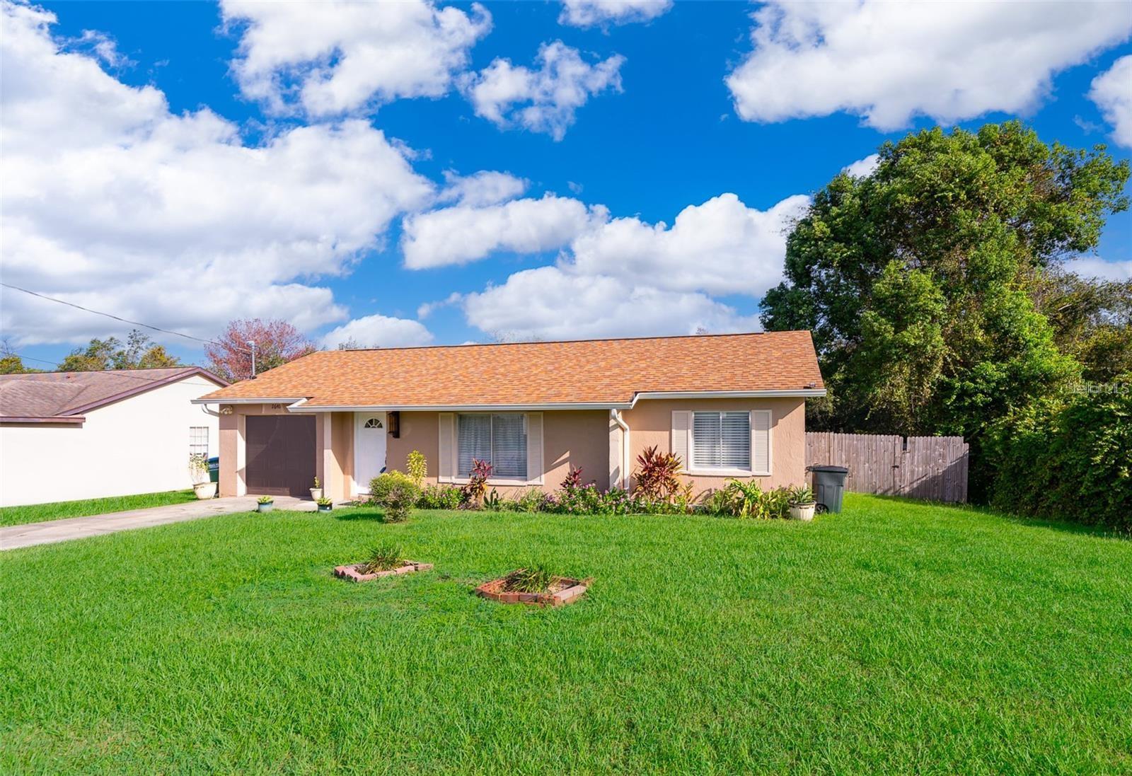 Very cute nicely landscaped move in ready block home in a newer area of Deltona. This completed renovated home sits on almost 1/2 ACRE WITH NO REAR NEIGHBORS for ultimate privacy and NO HOA. Oversized fence backyard offers plenty of space to build your own private outdoor oasis. Need some space between you and your neighbors? Have an RV, boat and/or trailer but don't want to pay for storage? No problem! This home is located in a quiet neighborhood within minutes of I-4, easy access to Sanford airport, downtown Sanford, New Smyrna Beach and 45 minutes to Daytona Beach. Roof (2020) Paint (2022). Large open and bright living area takes you into dining room and the kitchen sliding door leads you out to the 14X19 enclosed room which is amazing for your morning coffee and be uses as kid's playroom with a beautiful ceramic tile overlooking the private backyard. This home has an oversized one car garage. Plenty of parking with a separate area to left of the driveway.
