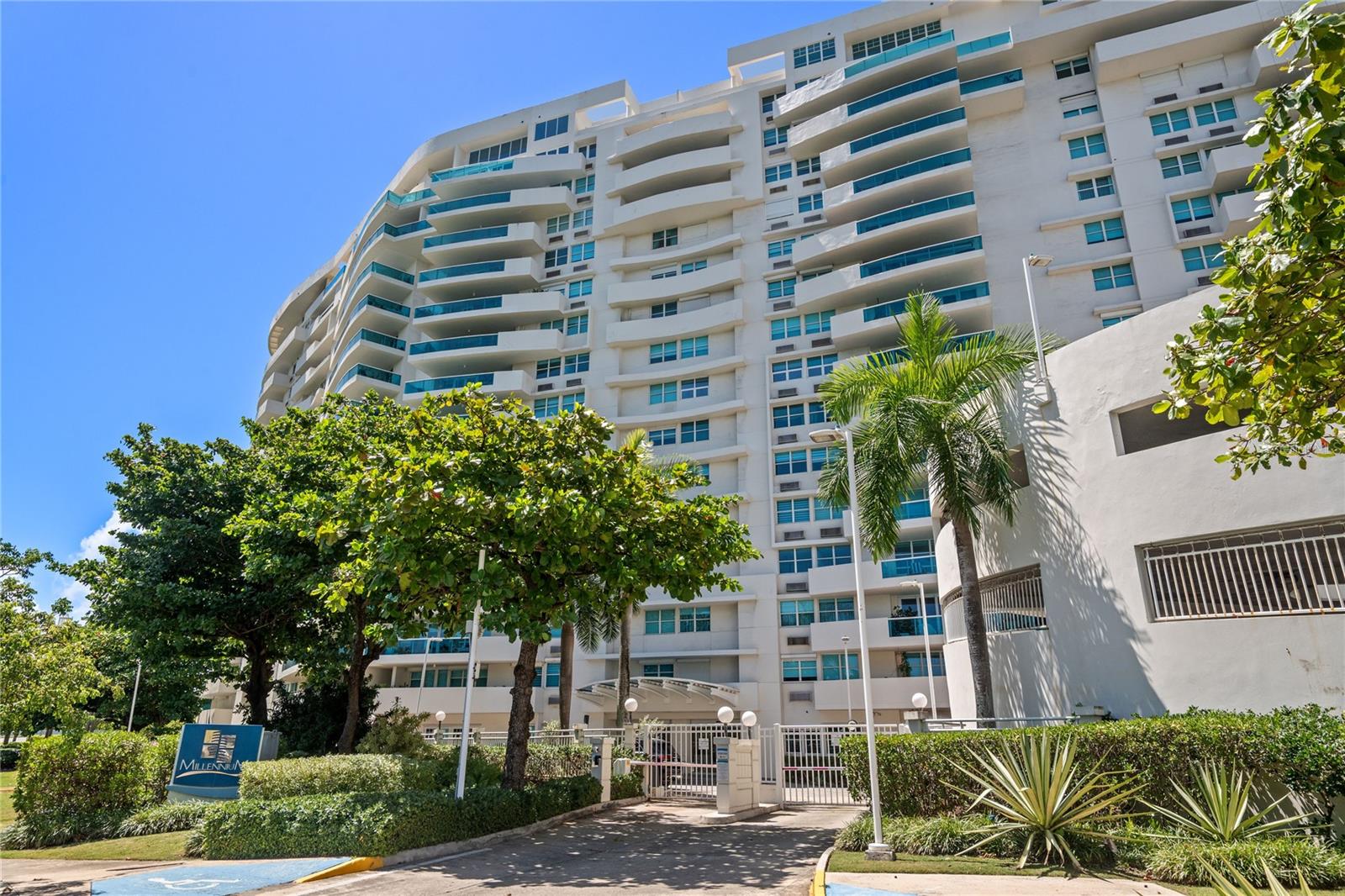 Rising above the San Juan shoreline, this two-story penthouse at Millennium pairs expansive interiors with panoramic views of the Atlantic Ocean and Condado Lagoon.
On the 16th floor, it is one of only ten penthouses in the building and the only one currently available for lease. Spanning over 2,500 square feet of recently remodeled space, the property balances the scale of a private residence with the conveniences of a full-service condominium.
The first level opens with a foyer, guest half bath, and a large living and dining area framed by large windows and a balcony with sweeping 270-degree views. A newly remodeled kitchen with brand-new appliances anchors the space, while a full bedroom suite with walk-in closet and spa-style bath with jacuzzi tub completes the floor.
Upstairs, a mezzanine provides an ideal setting for an office or family room with direct ocean views. The primary suite occupies its own wing, featuring a private balcony with floor-to-ceiling windows, storm-shuttered windows, a spacious bathroom with separate shower and jacuzzi tub, and a walk-in closet with his-and-hers sections. A secondary bedroom with en-suite bath and large closet is also located on this level, along with a flex space suited for a library or study.
The property includes four covered parking spaces, optional storage, and high-speed fiber optic internet.
Millennium itself is among San Juan’s most prestigious addresses, offering concierge and valet services, 24-hour security, a fitness center, dog park, kids’ playground, visitor parking, and a community room for private events. Full power generation, backup systems for common areas, and a cistern guarantee uninterrupted living, while services such as dry cleaning pickup and pet walking highlight the building’s attention to comfort and care.
This penthouse is more than a residence—it is a rare property in the sky, crafted for those who value sophistication, privacy, and peace of mind in one of San Juan’s most coveted towers.