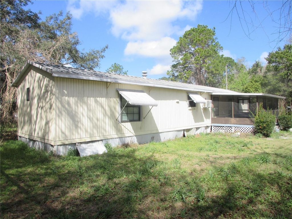 Photo of 18640 SE 22nd Lane, Silver Springs, FL 34488 (MLS # OM720810)