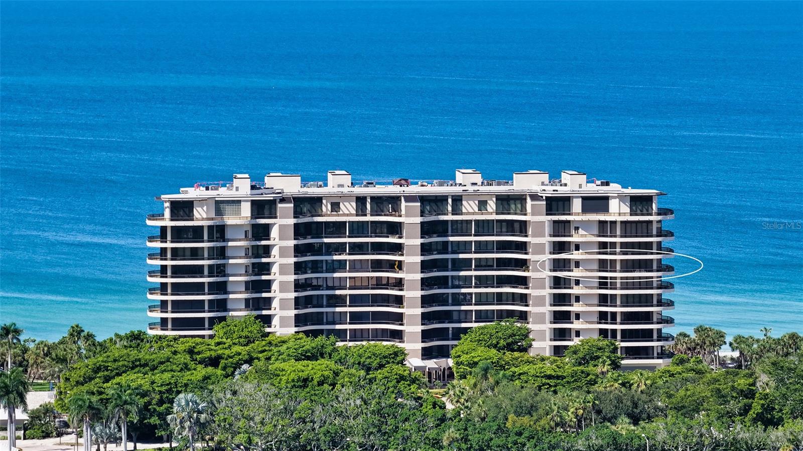 Savor the panoramic views and never-ending sunsets from this 7th-floor corner condominium, where the Gulf of Mexico, Sarasota Bay, downtown’s cityscape, and the manicured grounds of the Longboat Key Club’s Islandside golf course unfold in every direction. Elegant L’Ambiance is located on the southern end of Longboat Key, and the community entrance is adorned with water fountains, artistic creations, and has a 24hr manned gate leading to a secured building with a full-time concierge dedicated to attend to you and your every need. The elevator will take you to a private foyer leading directly into the residence. Here you’ll find lovely details such as a pecky cypress foyer ceiling, a dry bar, living room built-ins, cove lighting, expansive terraces, and never-ending views. The unit has two bedrooms, two and one-half baths, a full-sized laundry room and a back service entrance. The kitchen sports a center island and a breakfast nook with direct access to the expansive terrace. The main living area is open and spacious, filled with natural light with sliding doors open to the wraparound terrace. A split bedroom plan ensures privacy for you and your guests. Take in the gulf views from the primary bedroom suite, which has been recently enhanced with an extra-large closet. There is the added convenience of motorized blinds and drapes throughout. This gorgeous apartment comes with a private parking space, a storage unit and a wine locker. Other amenities include a luxurious beach-side pool with waterfalls, two har-tru tennis courts, a finely equipped fitness center, social rooms, guest parking, guest suites, and direct beach access. Living on Longboat Key, one of Florida’s most desirable areas, means more than a home — it’s a lifestyle. From the pristine beaches and world-class golf and tennis (membership required) to boutique shopping, fine dining, and cultural attractions just minutes away in Sarasota, you’ll enjoy the perfect balance of island tranquility and vibrant city life.